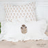 Molly Print Ruffle Lumbar Pillow featuring a charming block-printed floral design on crisp white cotton with a full ruffled edge.