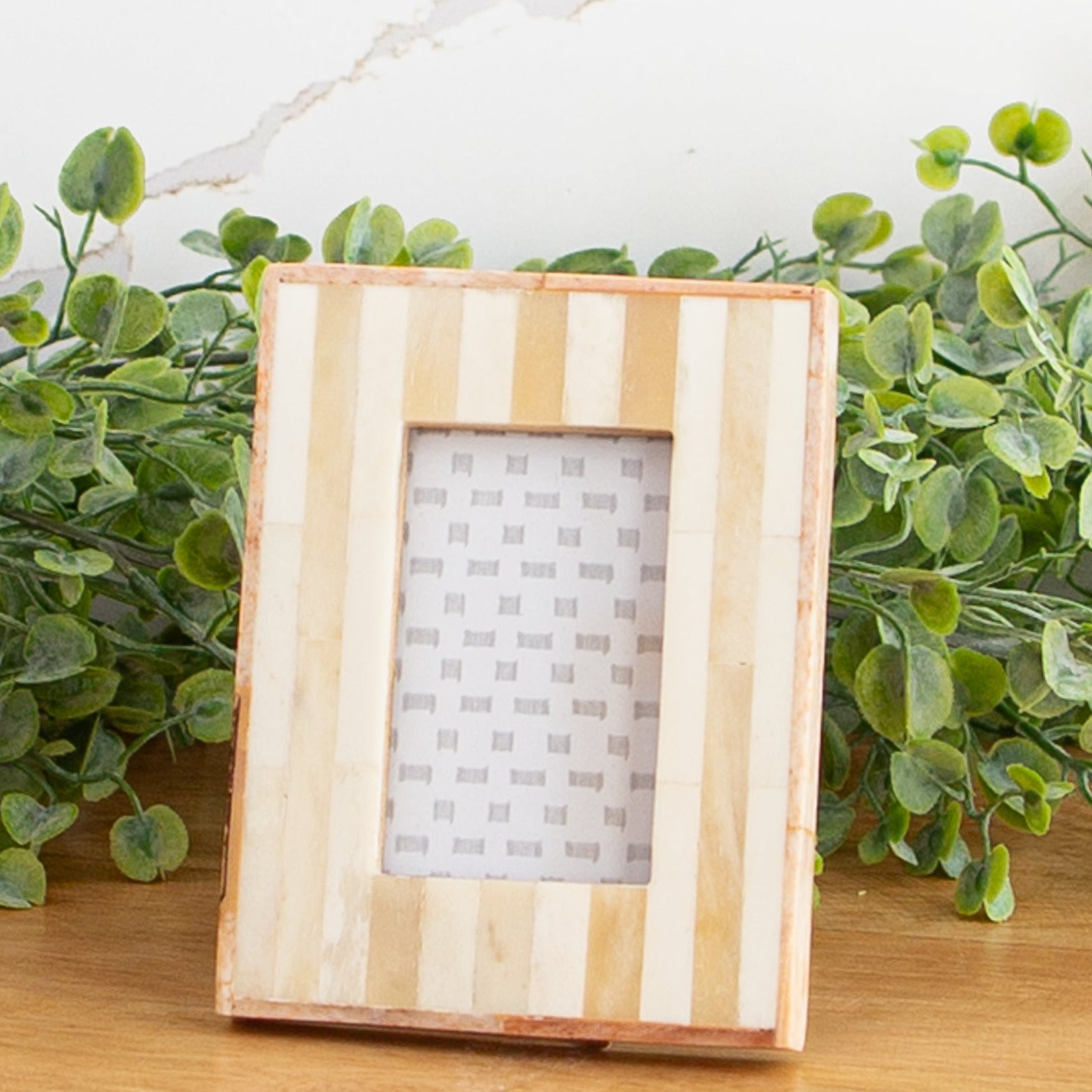 Handmade Striped Bone Inlay Photo Frame showcasing a 2" x 3" picture in a stylish design.