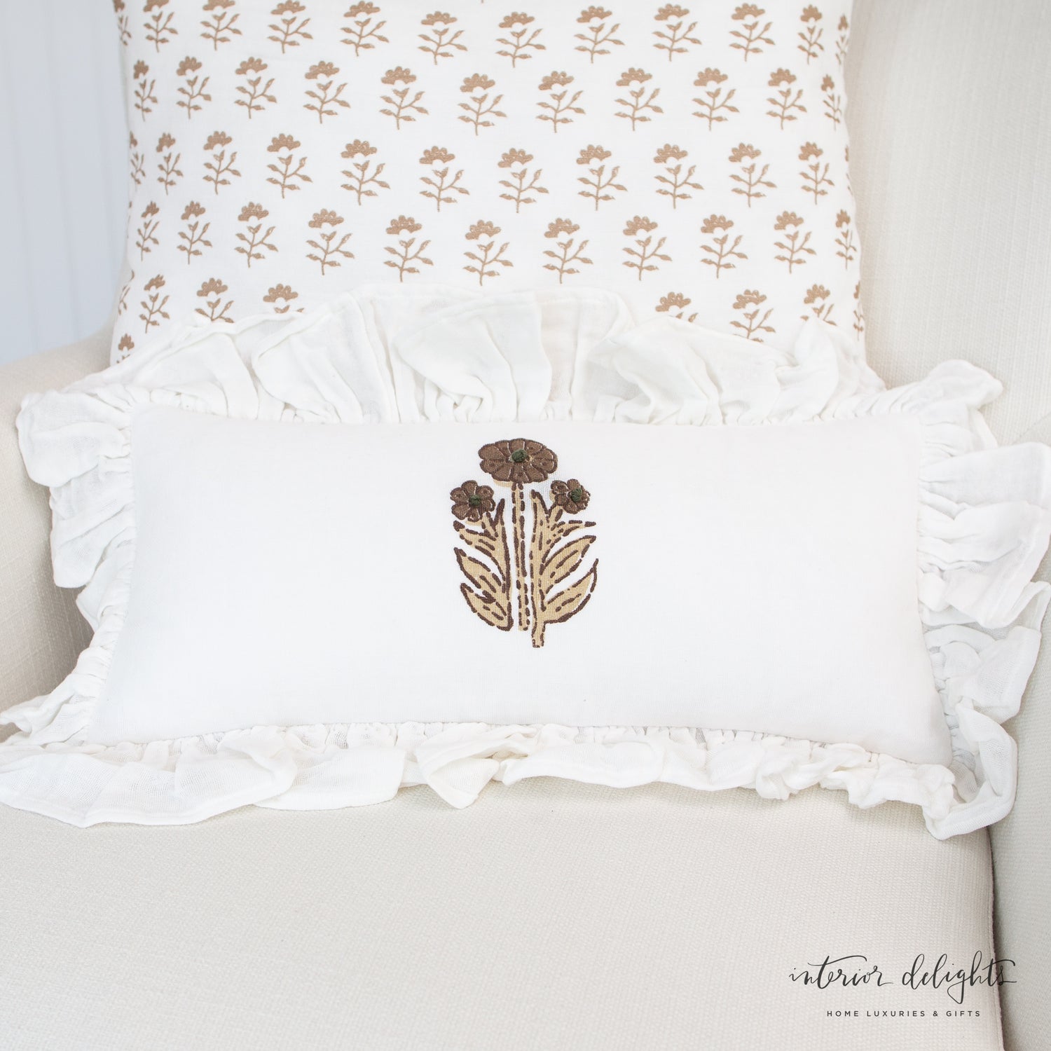 Molly Neutral Block Print Pillow showcasing a light brown floral design on soft white cotton, perfect for adding charm to any decor.