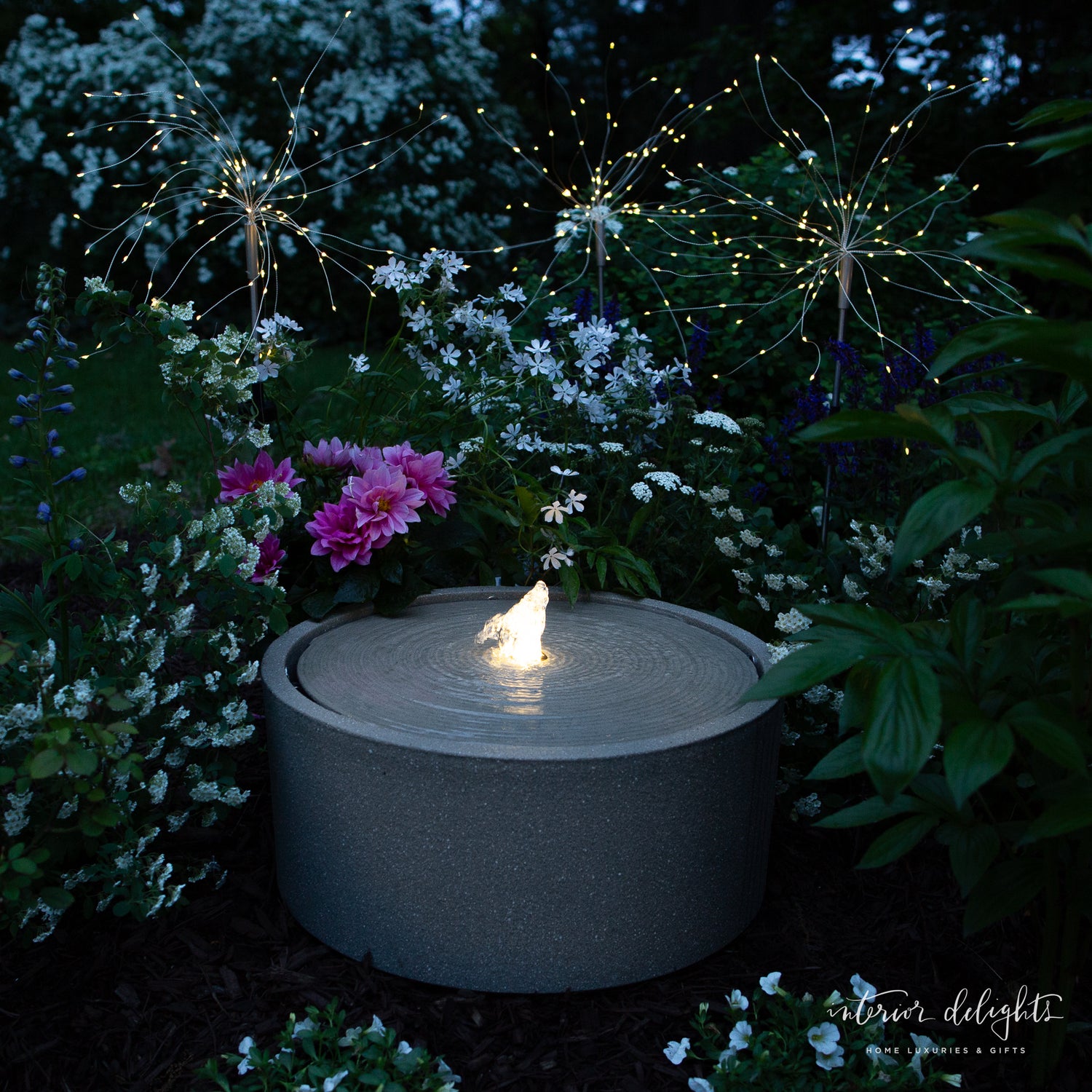 Dandelion Solar Stake Light illuminating a garden path with bendable wire lights resembling dandelions.