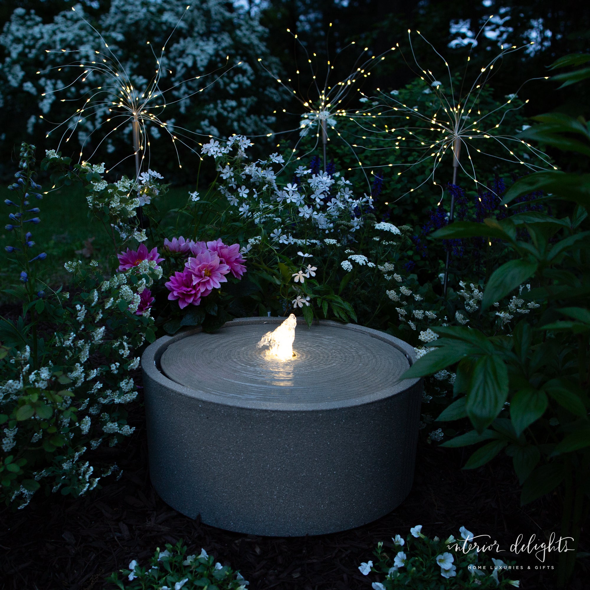 Dandelion Solar Stake Light illuminating a garden path with bendable wire lights resembling dandelions.
