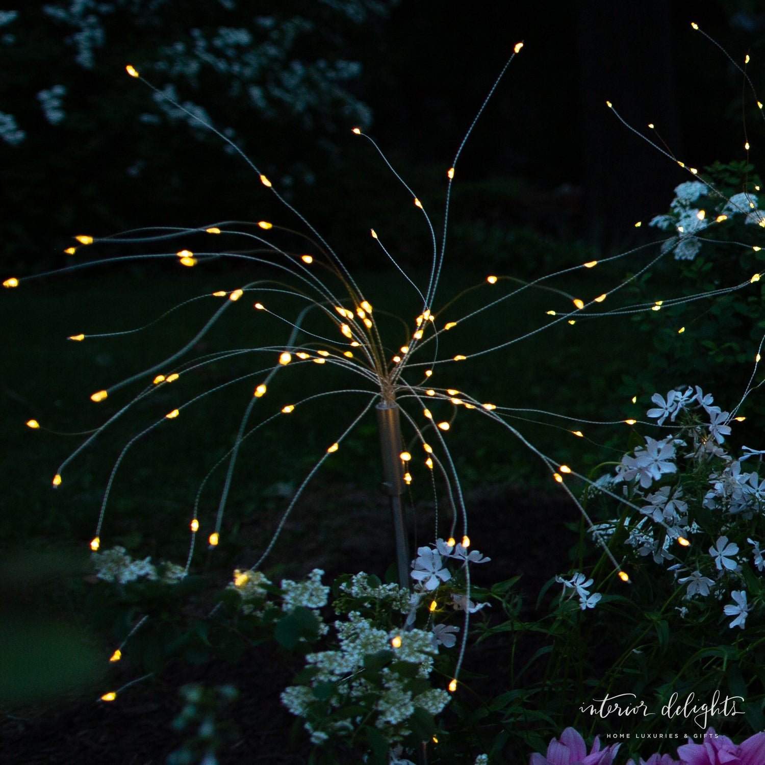 Close-up of Dandelion Solar Stake Light showing warm white glow effects, perfect for enhancing outdoor spaces.