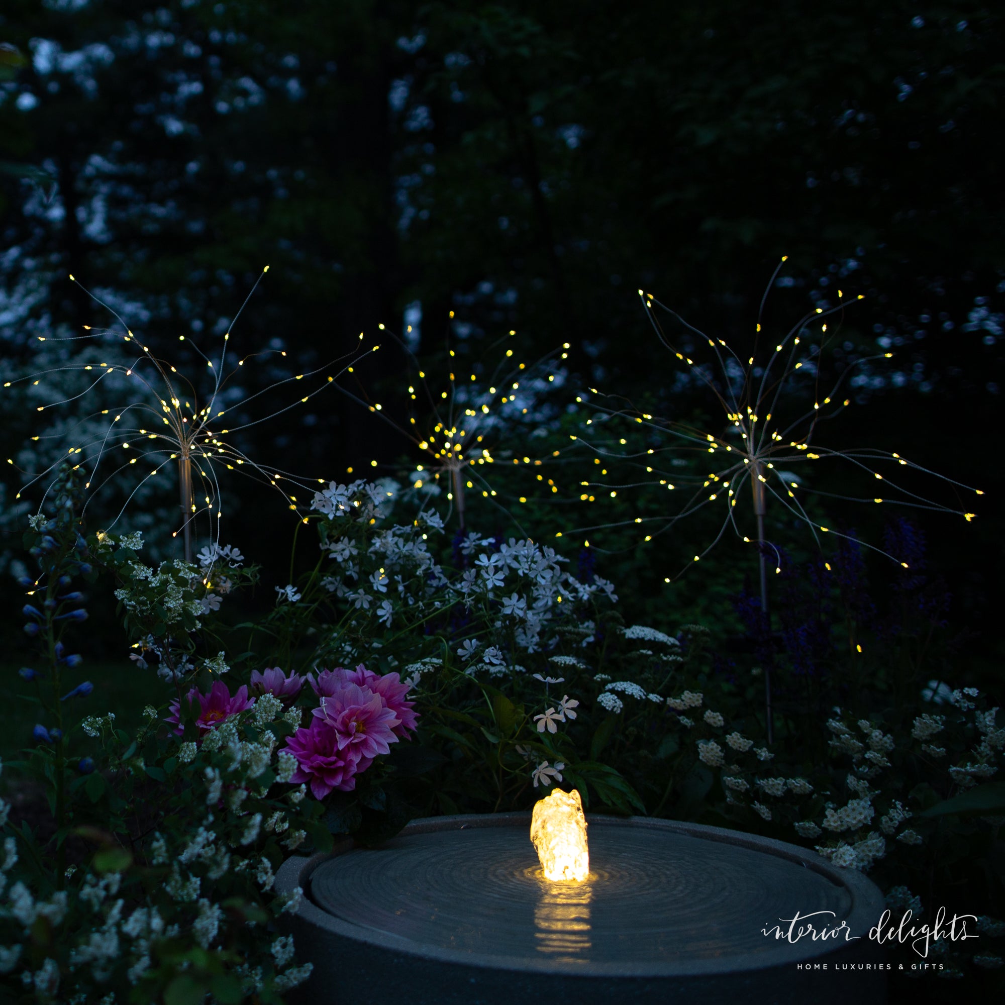Close-up of Dandelion Solar Stake Light showcasing its glowing wire lights that spread like dandelion seeds.