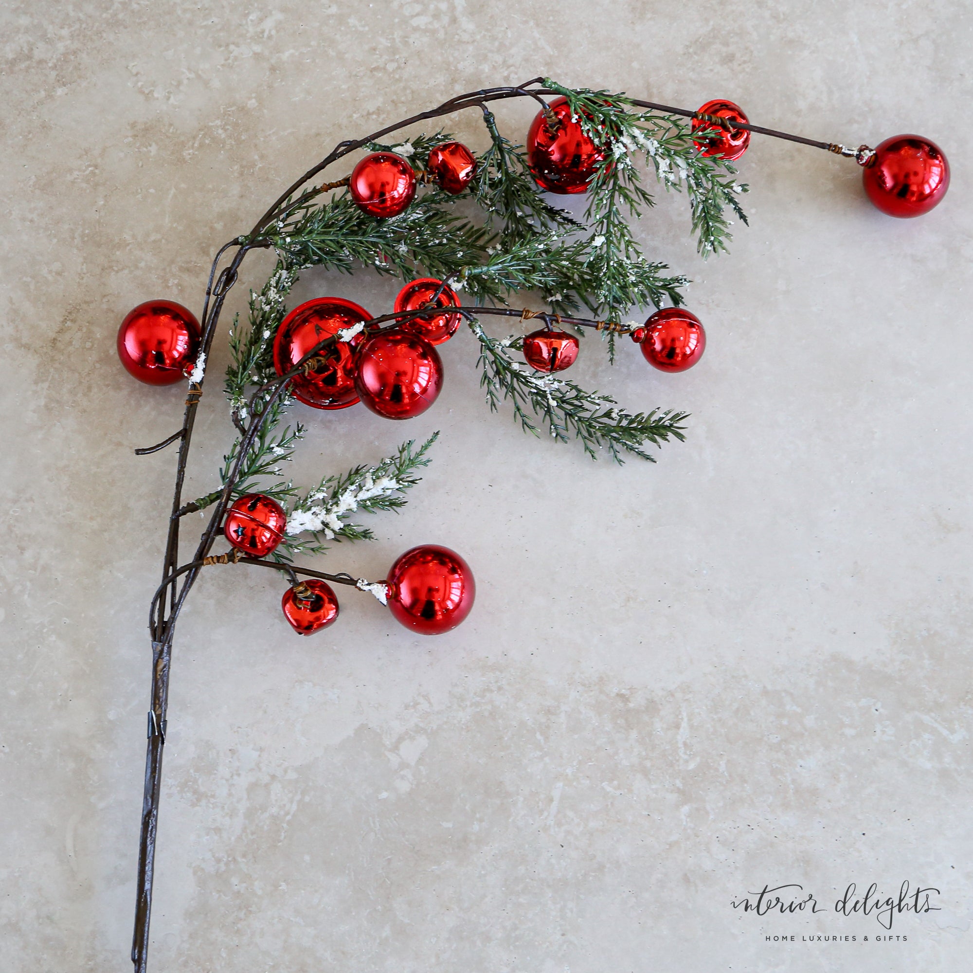 35" Snowy Pine Branch With Red Bells, featuring snowy pine needles and vibrant red jingle bells, perfect for holiday decor.