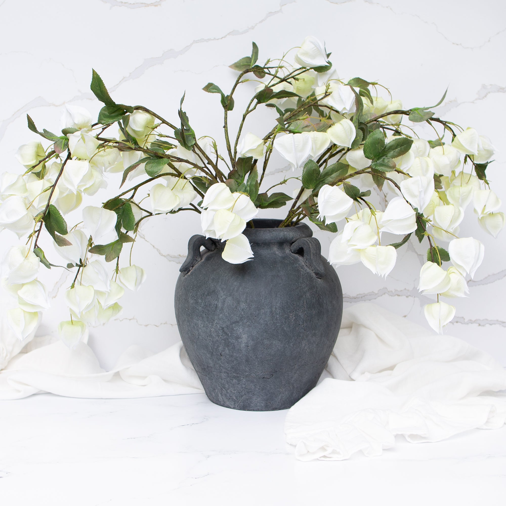 Elegant 11" Charcoal Clay Pot on a wooden table, highlighting its rich charcoal color and sturdy design.