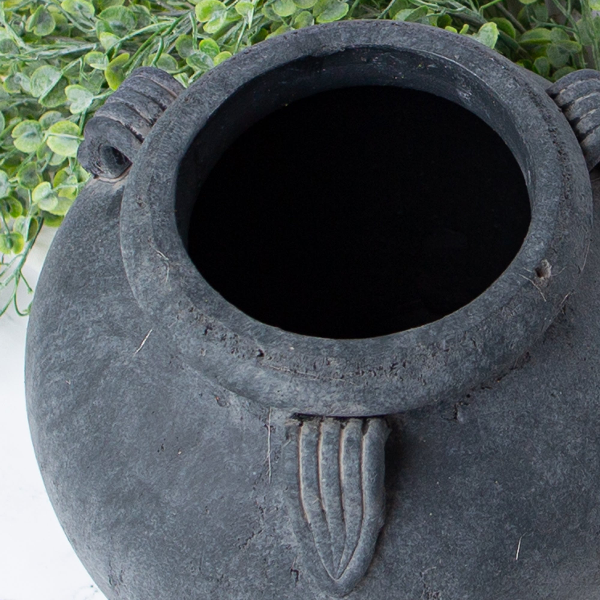 Close-up view of the 11” Charcoal Clay Pot showcasing its rich texture and handcrafted details.