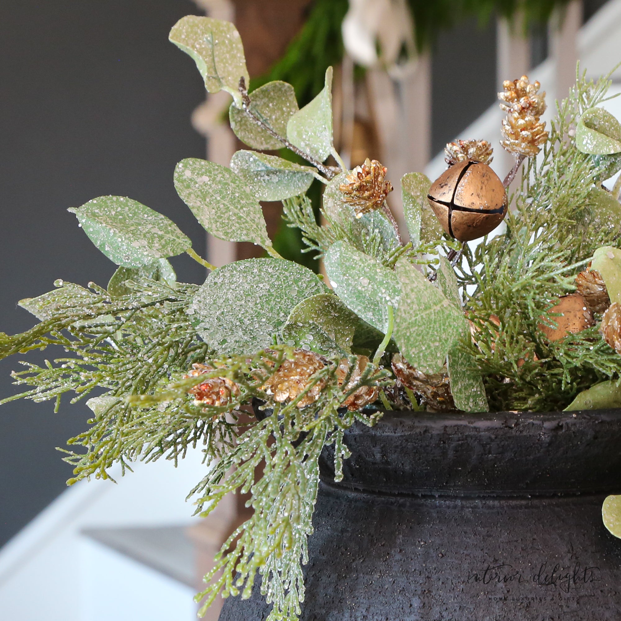 Close-up of the Golden Bell Eucalyptus Pick 15", showcasing its shimmering golden bells and realistic eucalyptus leaves.