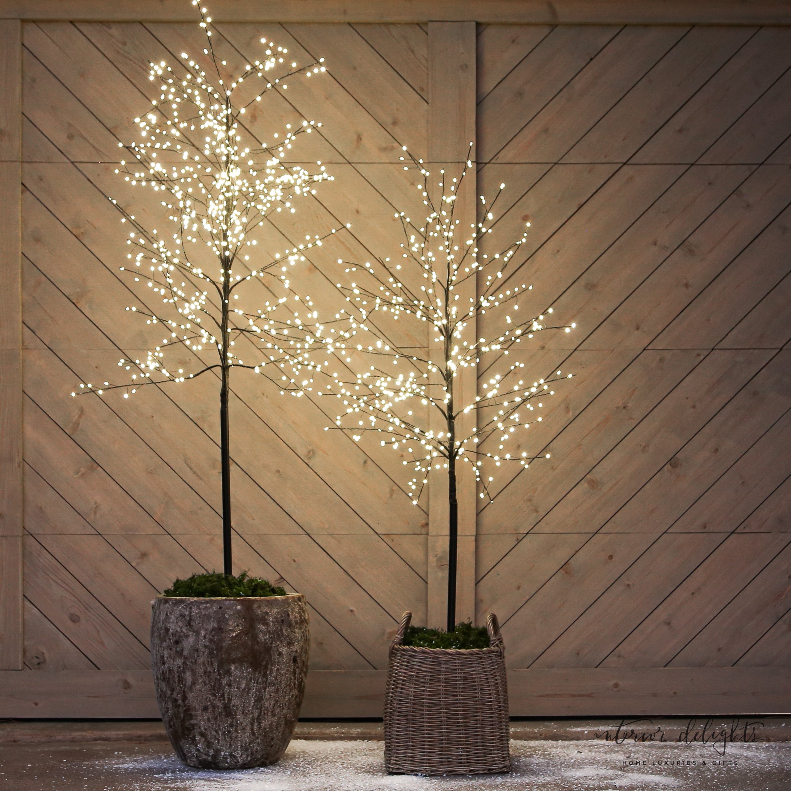 Slim Trunk Sparkle Tree available in 59" or 70", showcasing warm glowing LED lights for cozy indoor and outdoor decor.