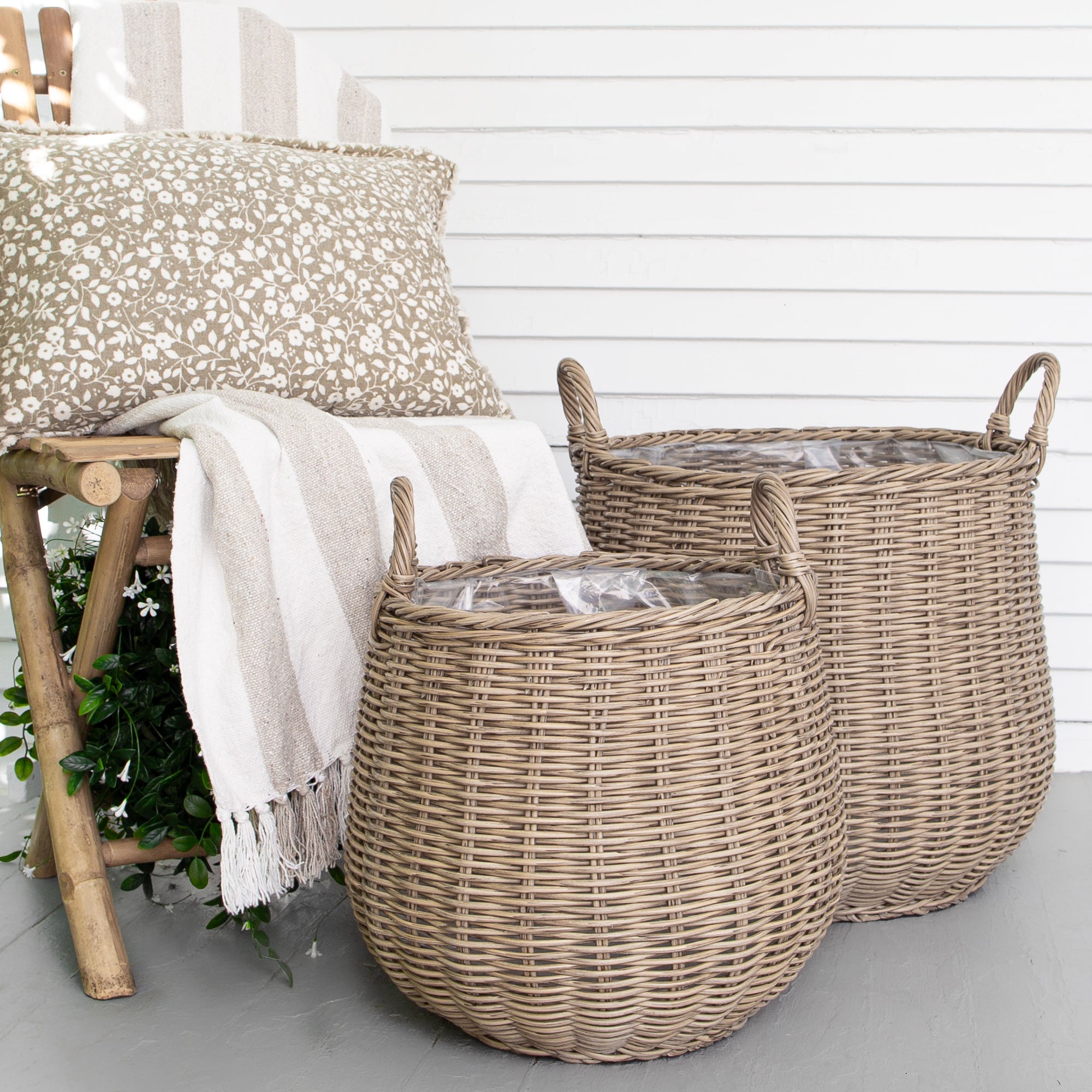 Round Willow Planter Baskets displaying rustic charm, perfect for home gardening with sturdy handles and a plastic interior for soil.