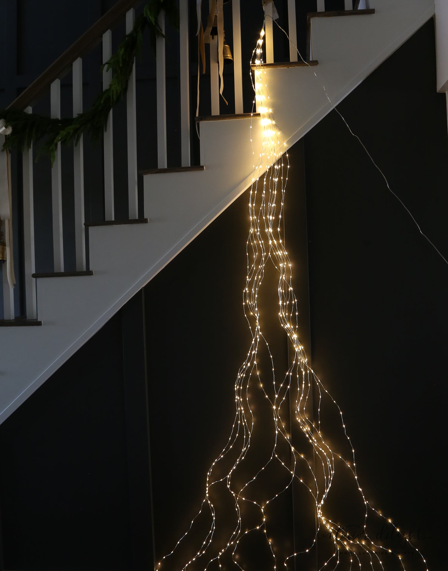 Installation detail of the Game Changer Micro LED Tree Bunch, featuring flexible strands for easy holiday decoration.