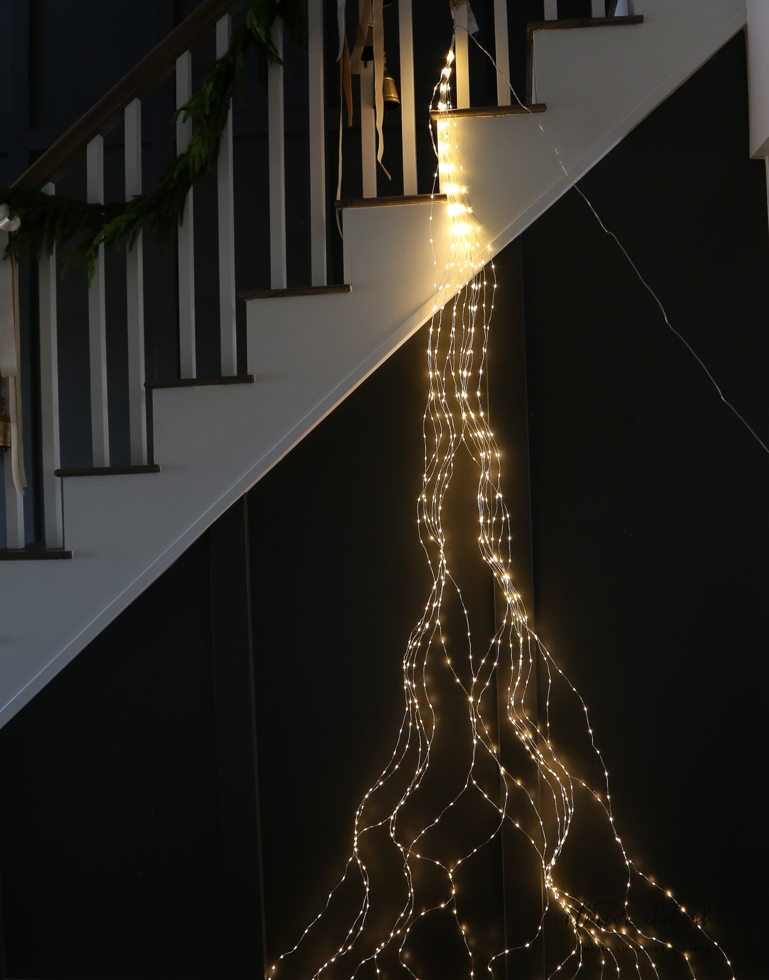 Installation detail of the Game Changer Micro LED Tree Bunch, featuring flexible strands for easy holiday decoration.