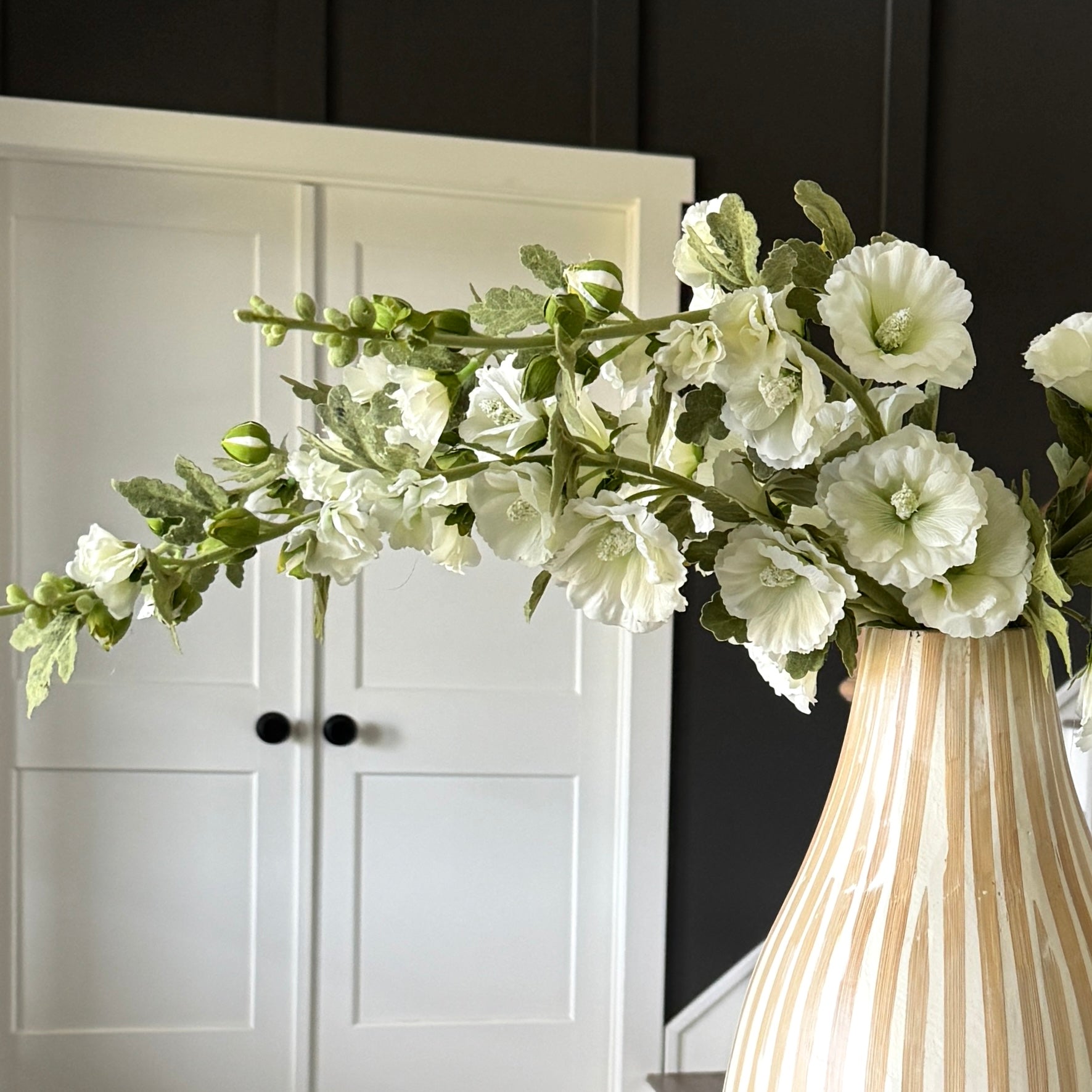 Hollyhock & Large Striped Vase Arrangement