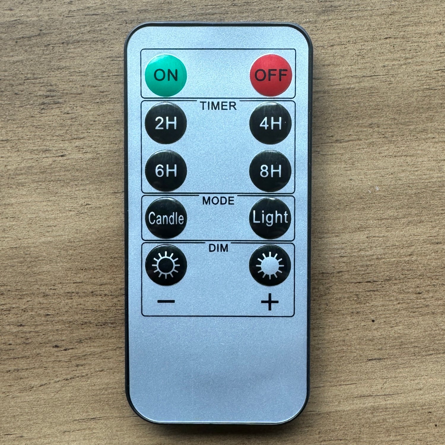 REMOTE CONTROL for flameless candles with timer and dimming features, perfect for setting ambiance.