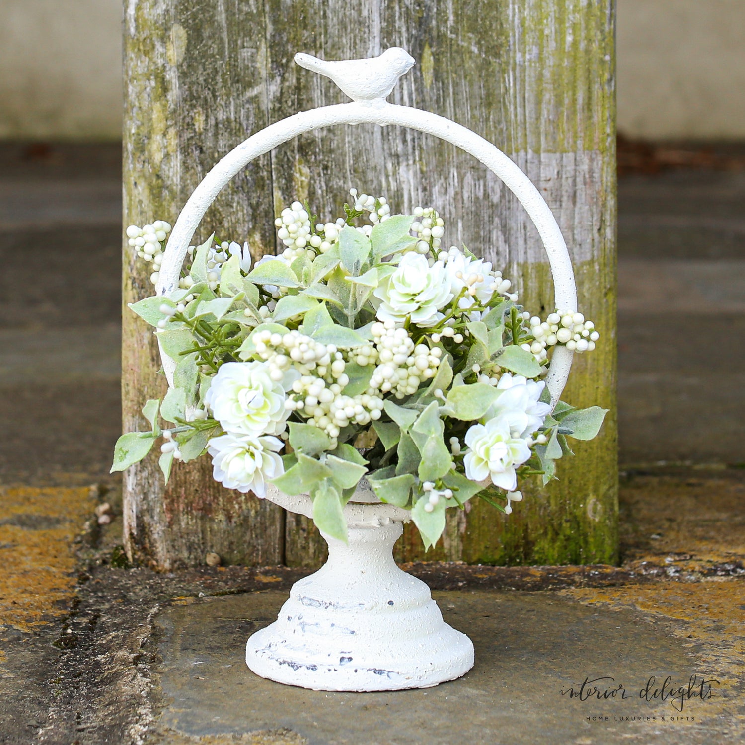 Chic Meadowlark Stand used with a vibrant pouf for an elegant display.