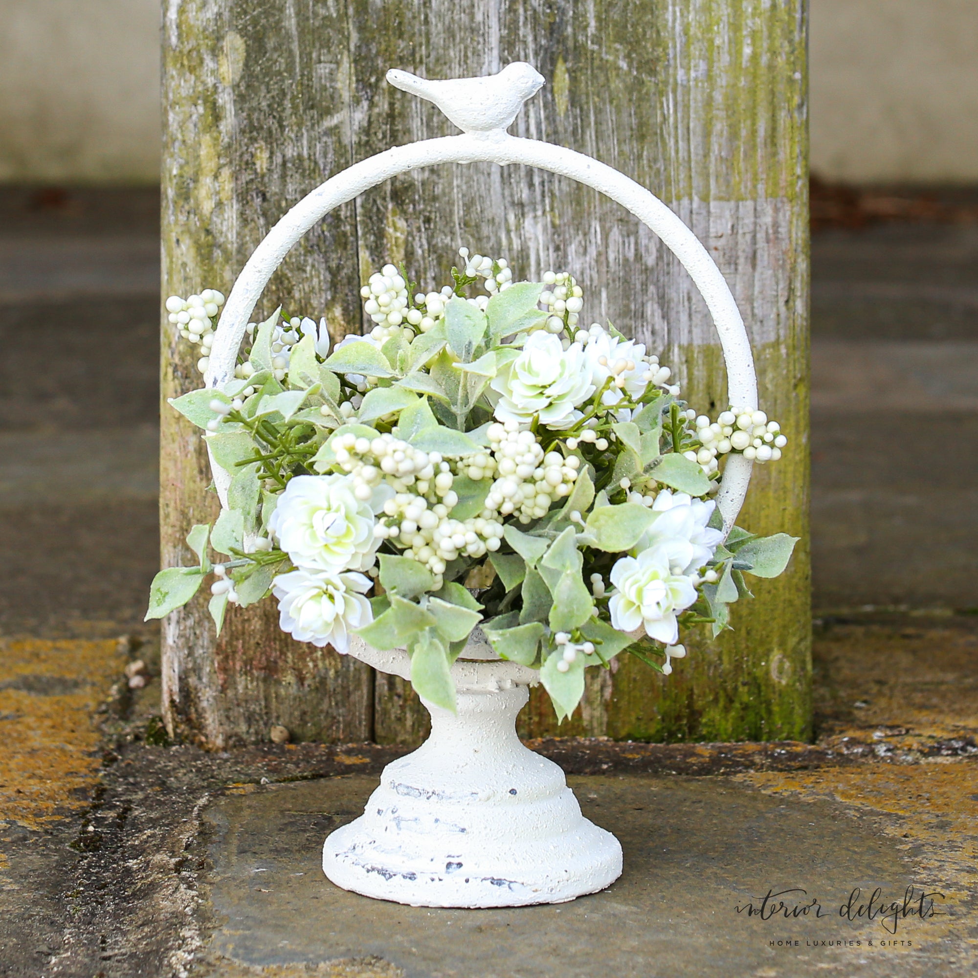 Chic Meadowlark Stand used with a vibrant pouf for an elegant display.