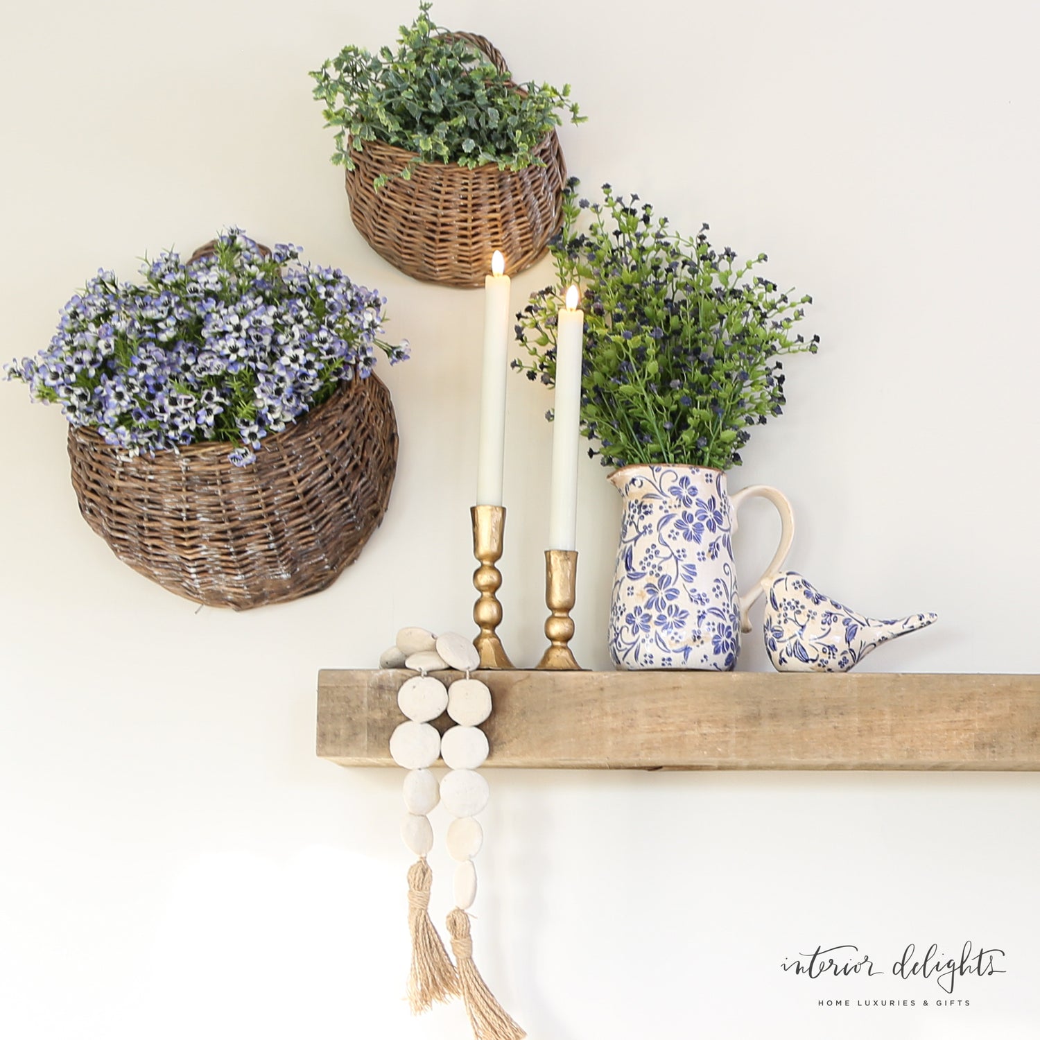 Ceramic Blue Floral Pitcher displayed with fresh flowers, adding charm to any table.