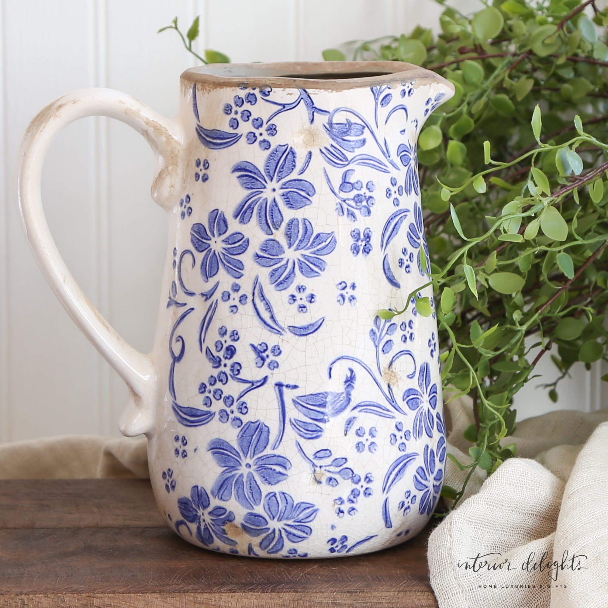 Ceramic Blue Floral Pitcher with delicate blue floral design, perfect for vintage decor.