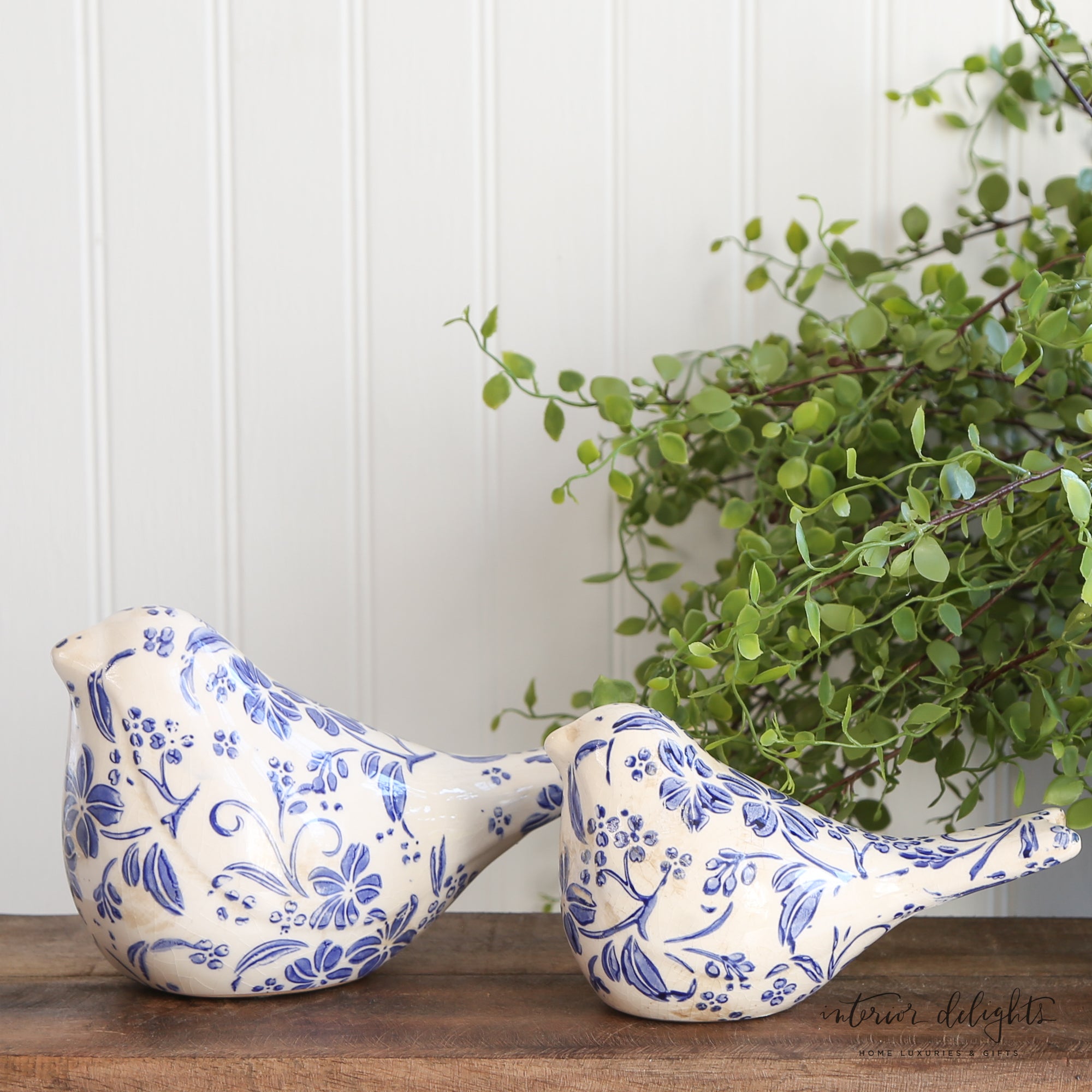 Charming Ceramic Blue Floral Birds - Set of 2, elegant decorative accents ideal for mantelpieces and tabletops.