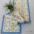 Meadows Blue and Gold Floral Table Runner features a beautiful floral design in soft shades of blue, yellow, and white, perfect for adding a European touch to your dining table, 16" x 72", ideal for any season.