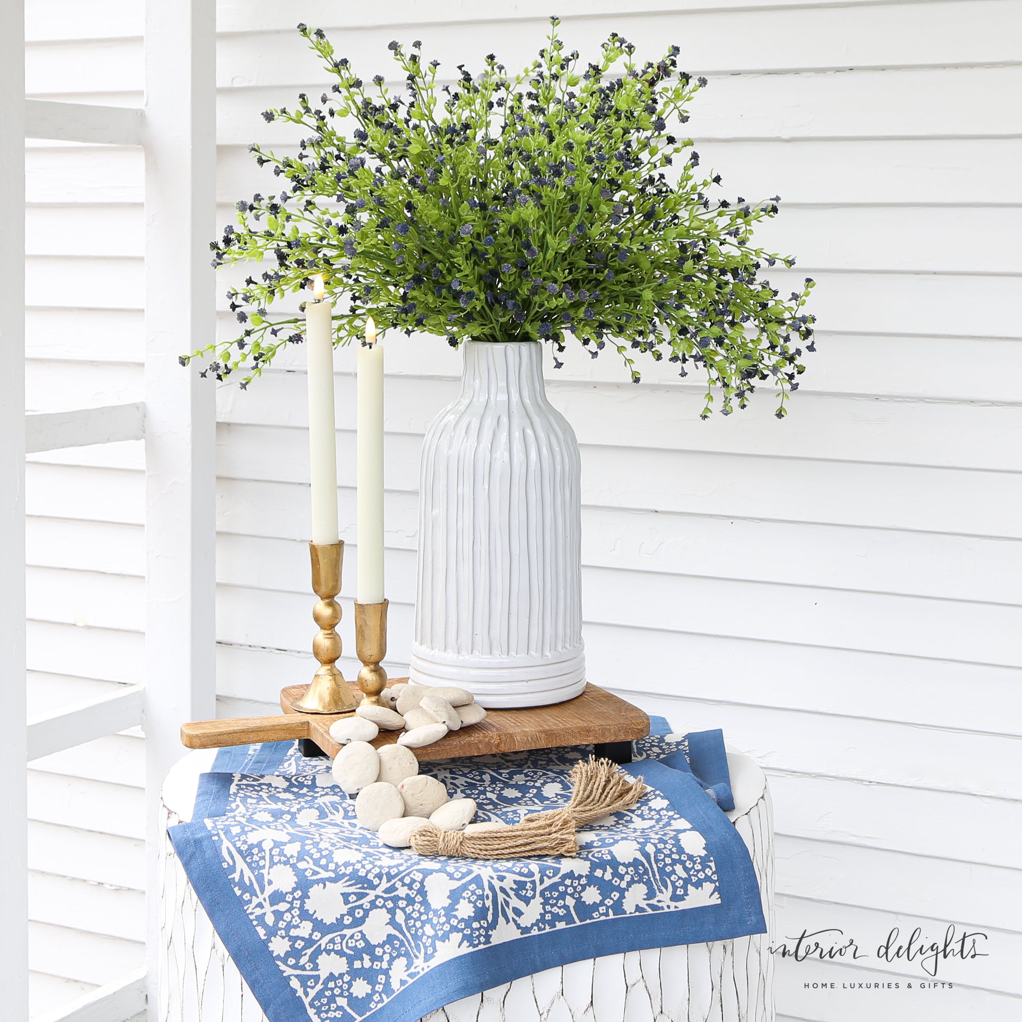 12” White Striped Vase showcasing high-quality ceramic design with textured horizontal and vertical lines, perfect for displaying greenery.