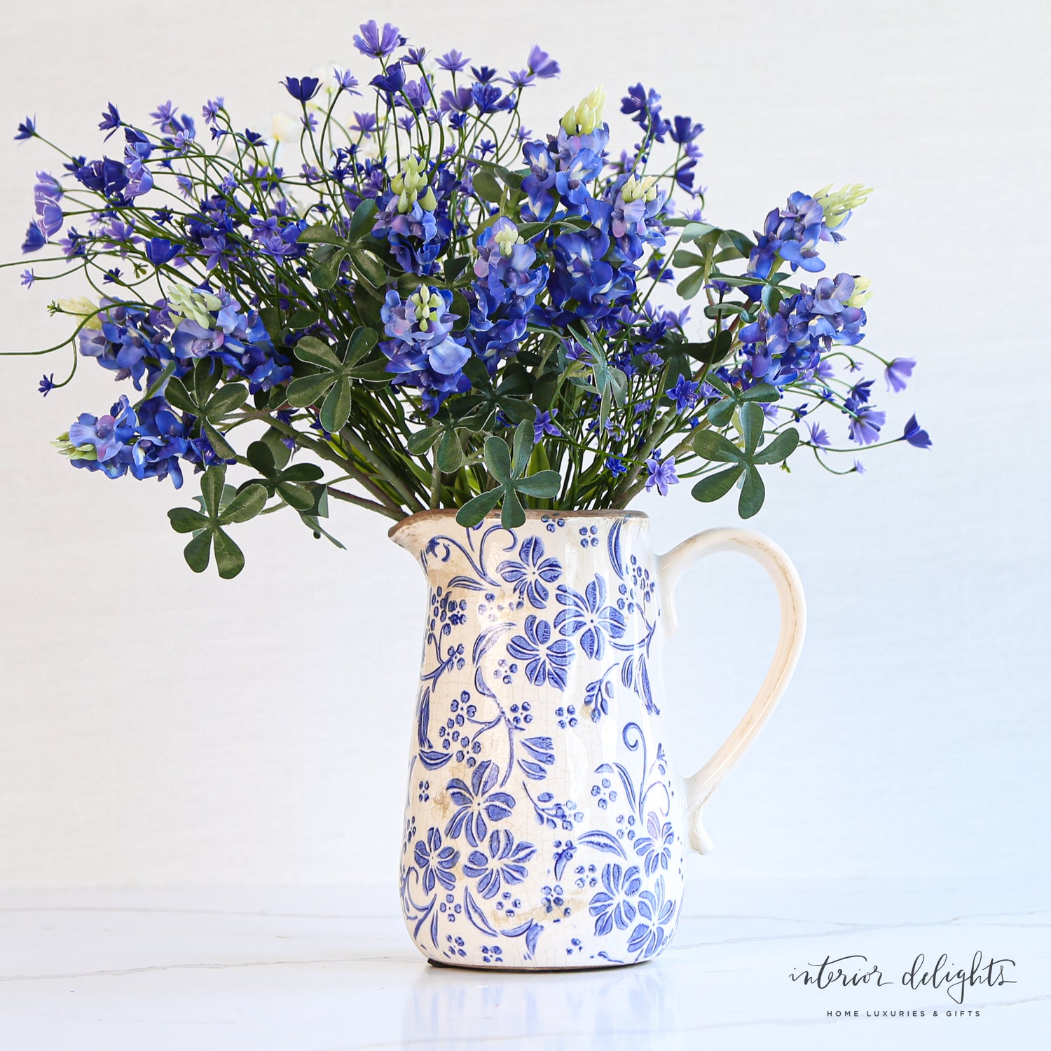 Side view of Ceramic Blue Floral Pitcher highlighting its elegant shape and design.