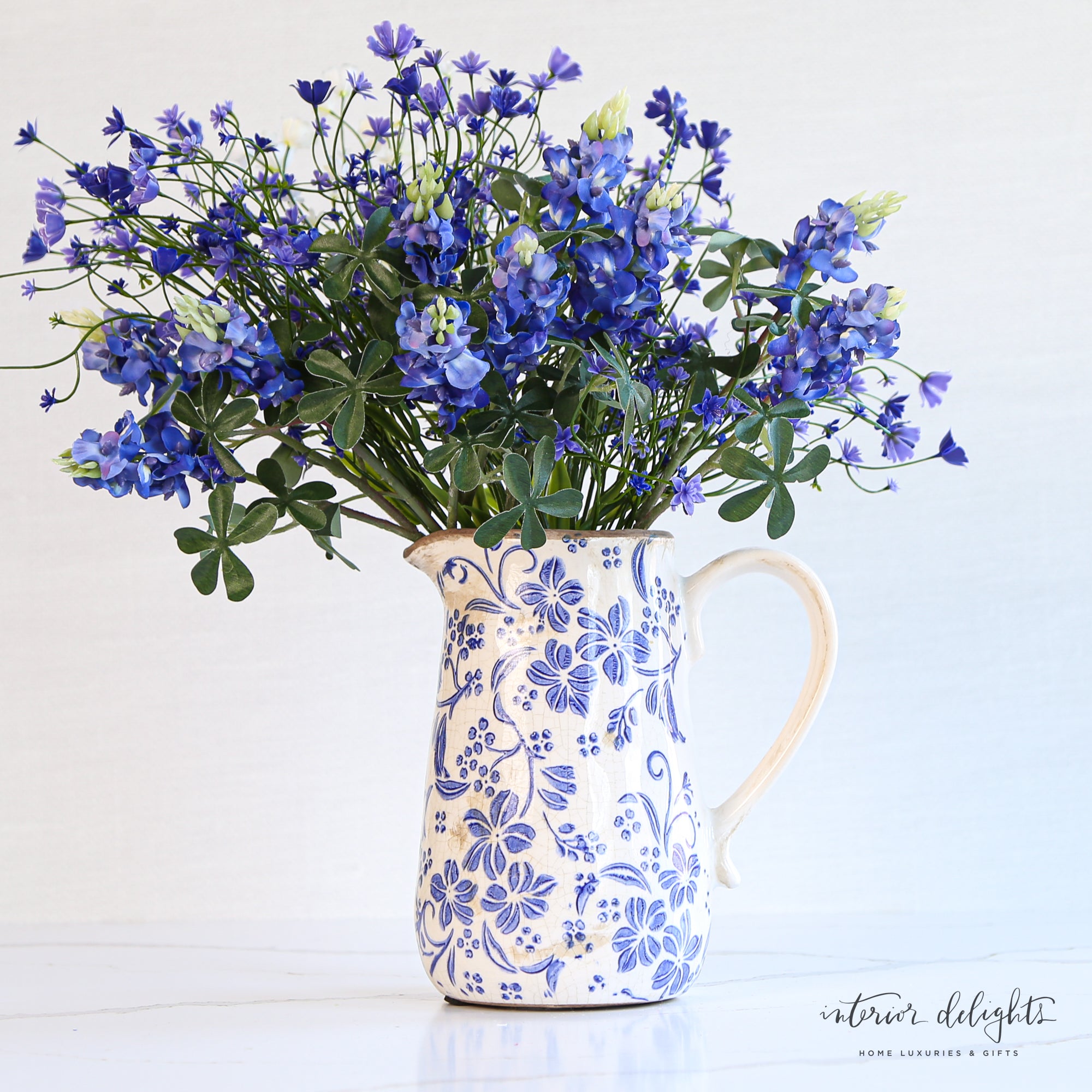 Side view of Ceramic Blue Floral Pitcher highlighting its elegant shape and design.
