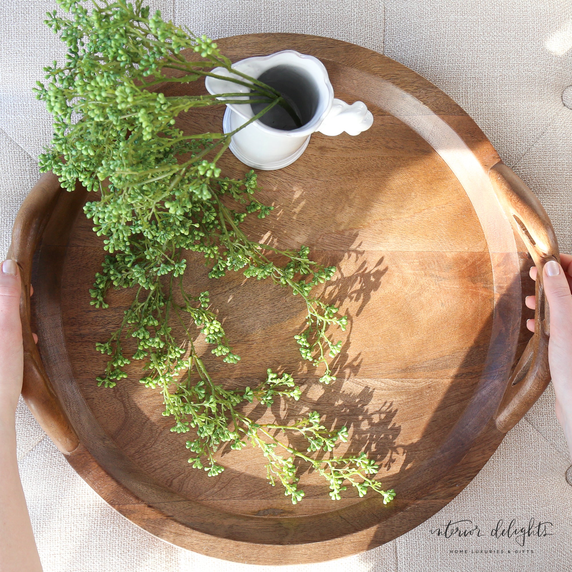 Side view of the Wood Braided Handle Tray highlighting its hand-carved quality and rustic charm.