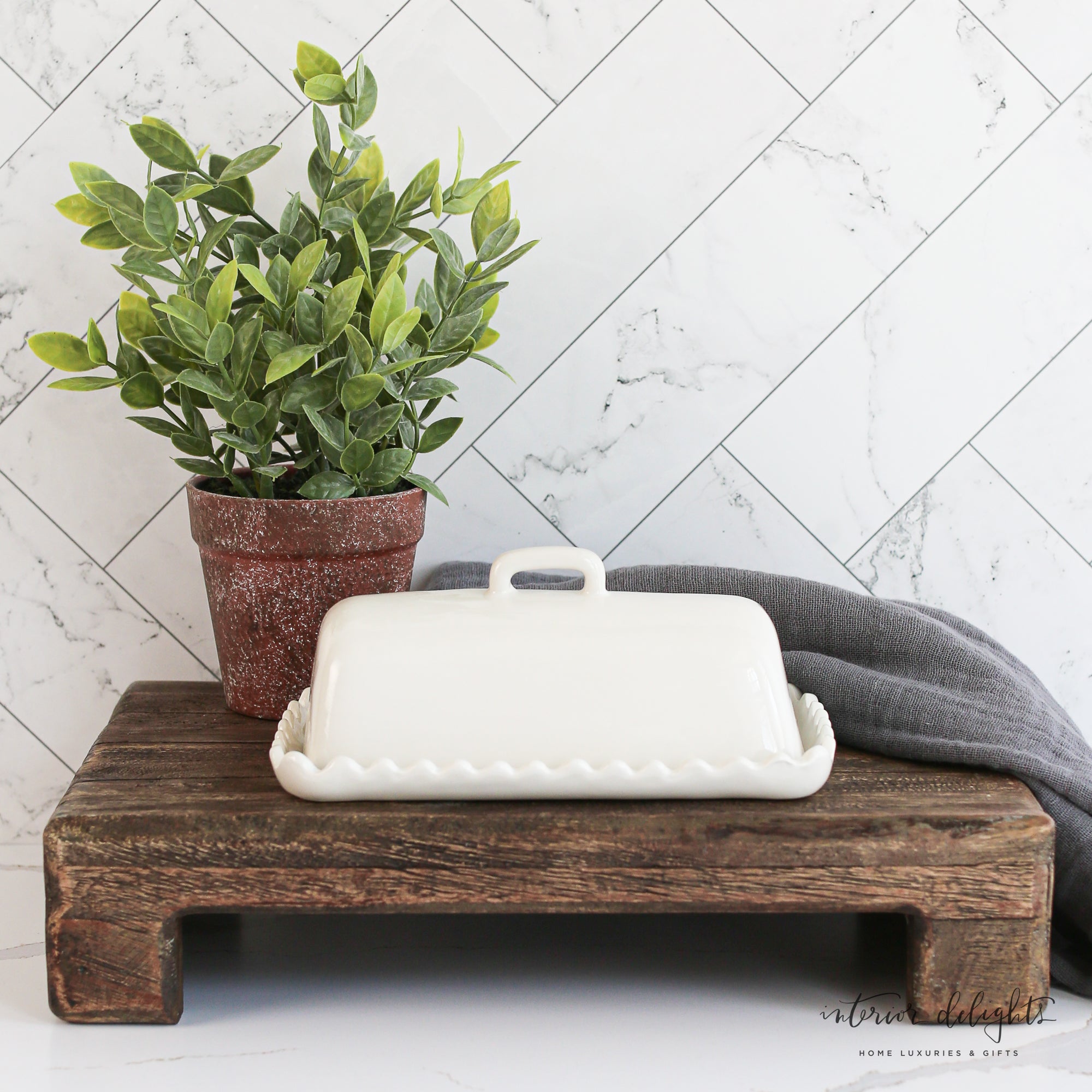 Stylish White Scalloped Butter Dish with a whimsical design, showcasing its microwave and dishwasher safe feature.