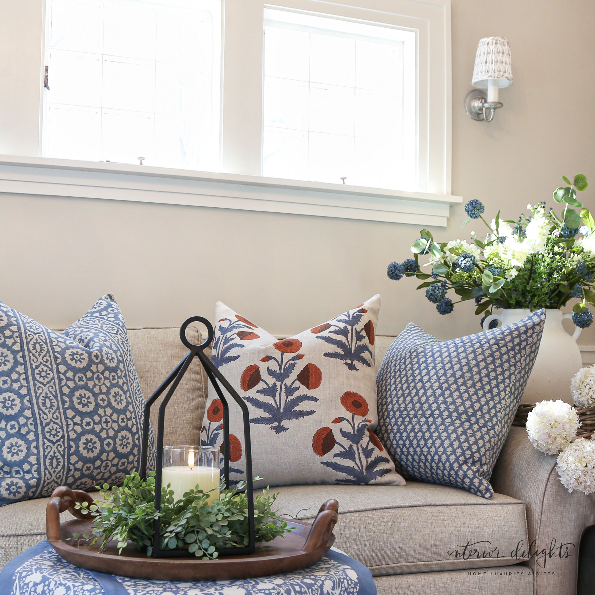 The Luxe Bleu Médaillon Pillow Cover fitting a 24" x 24" insert, perfect for achieving a plush and full appearance in your living space.