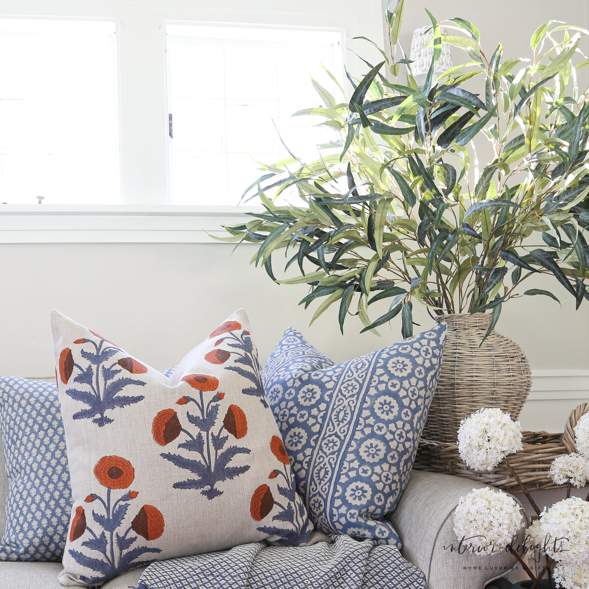 Luxe Bleu Médaillon Pillow Cover displayed with other decorative pillows like Luxe Poppy and Luxe Blue Fleurette for a stylish home decor inspiration.