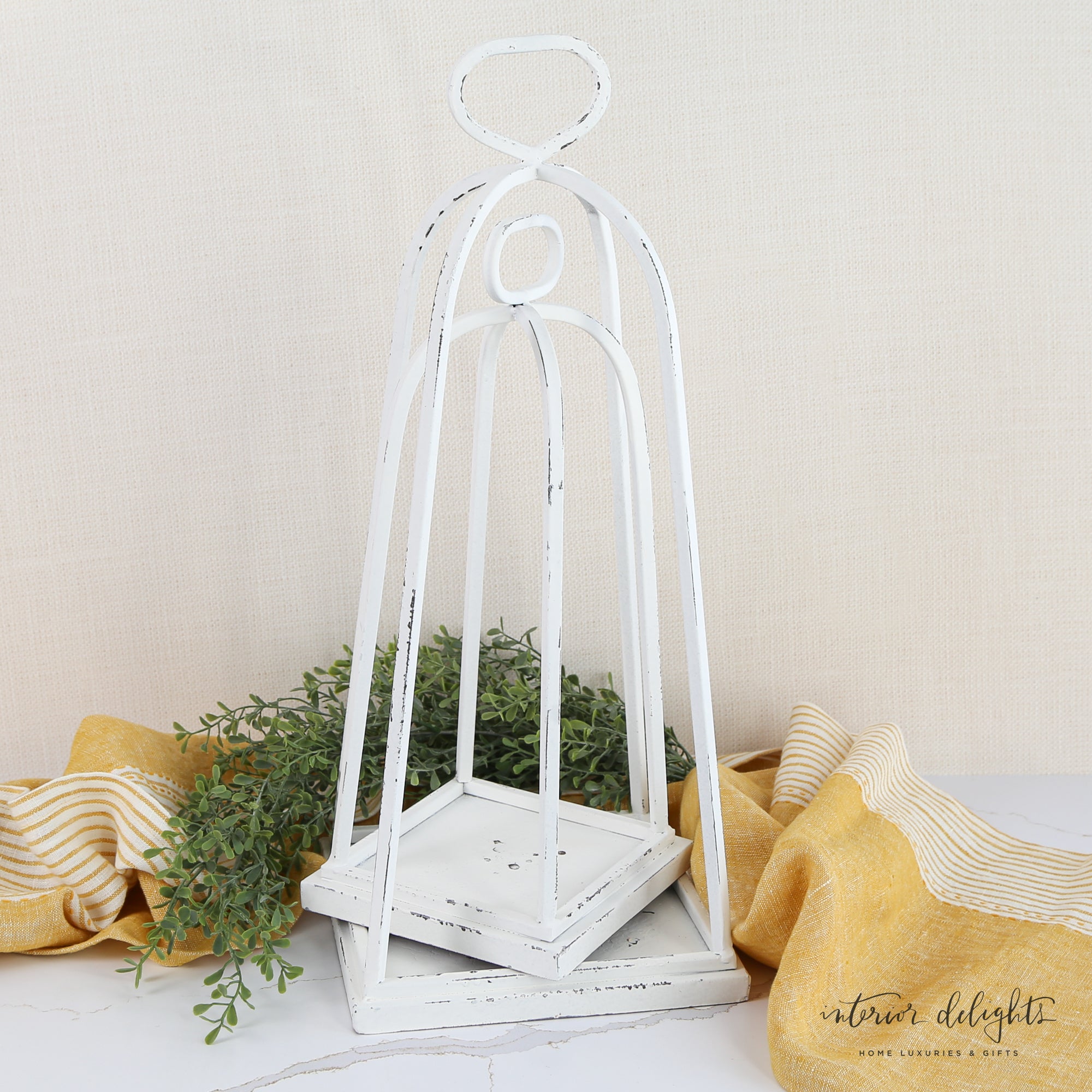 Stylish White Distressed Lanterns - Set of 2 with flameless candles inside for a flickering glow.