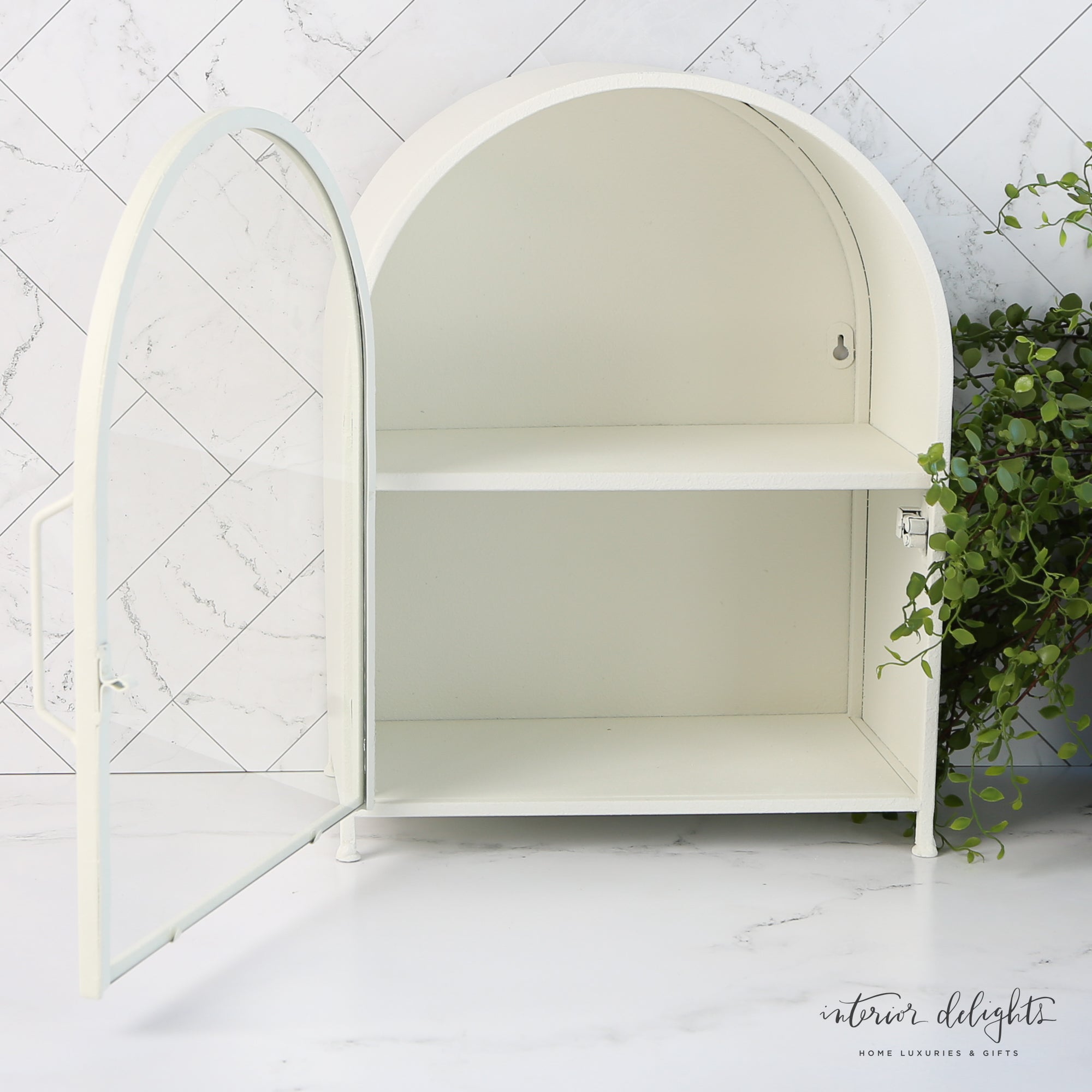 Arched Textured Metal Wall Cabinet with Glass Door showcasing organized items, ideal for kitchen or bathroom.