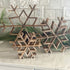 12” Medium Wooden Snowflake - Handcrafted winter decor for rustic home styling, featuring intricate design perfect for seasonal decorations.