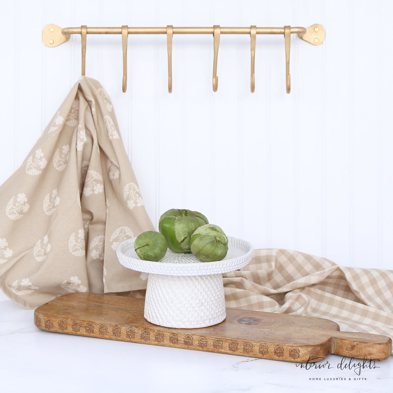Woven Ceramic Pedestals in both sizes, elegantly styled with Shively Greens Candle Ring and pouf for a charming display.