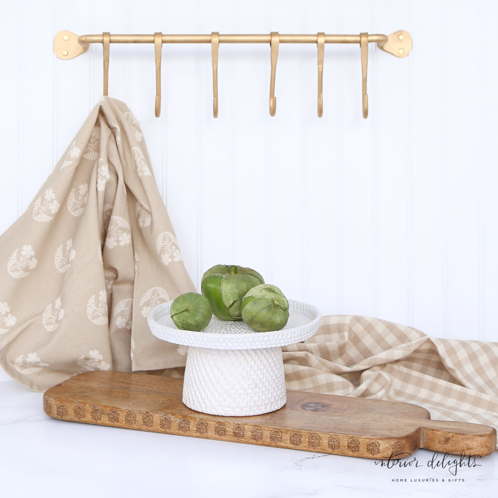 Woven Ceramic Pedestals in both sizes, elegantly styled with Shively Greens Candle Ring and pouf for a charming display.