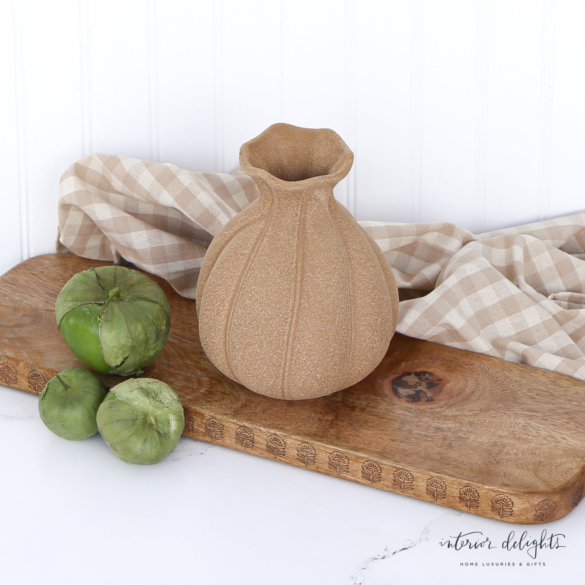 Elegant 7” Brown Stoneware Vase with curving pleats, perfect for floral displays or as a decorative piece.