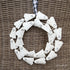 16 inch Ghost Wreath perfect for Halloween décor, showcasing a playful design on a round metal base.