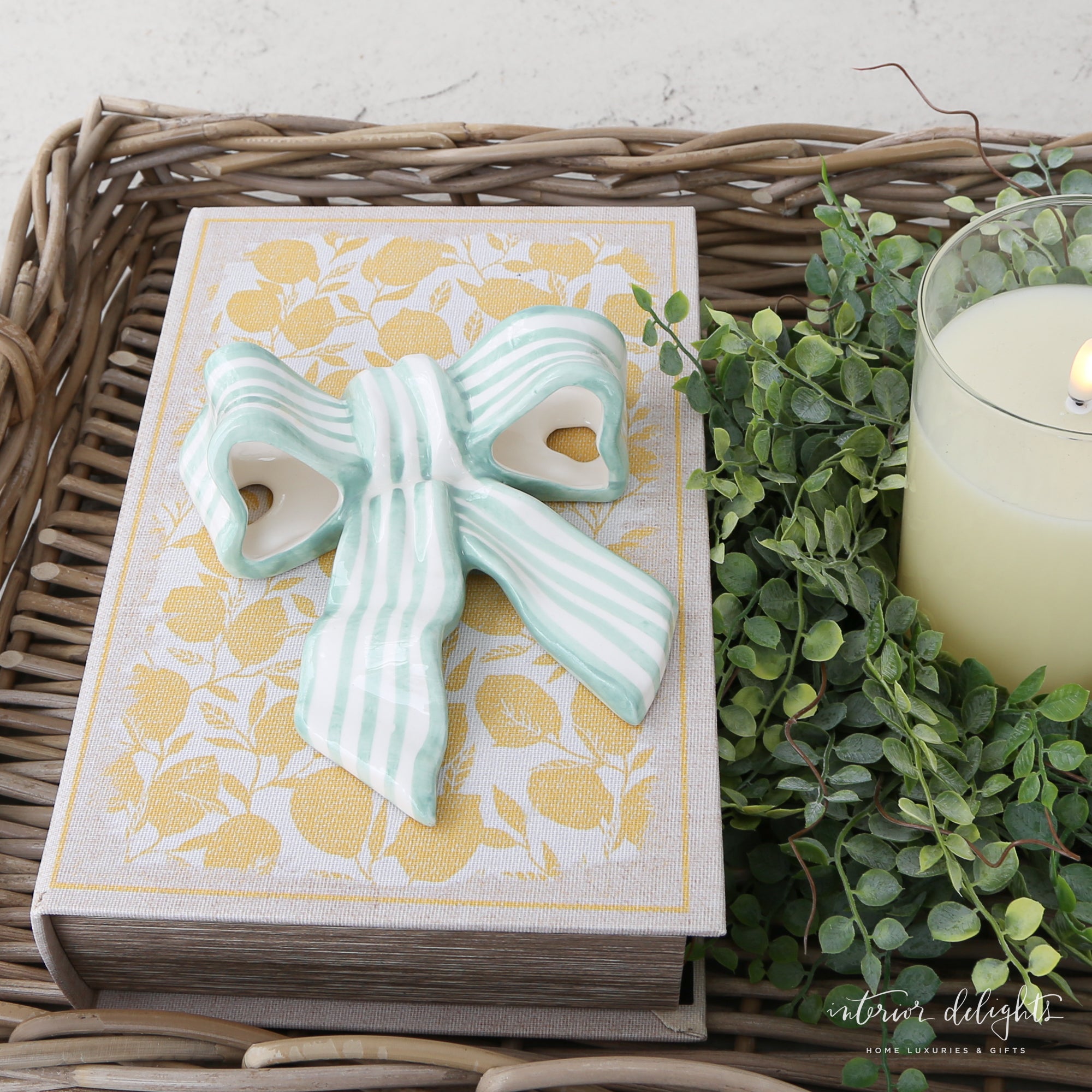 Stoneware Striped Bow in green and white, showcasing a glossy finish and playful striped pattern, perfect for home decor and functional accent.