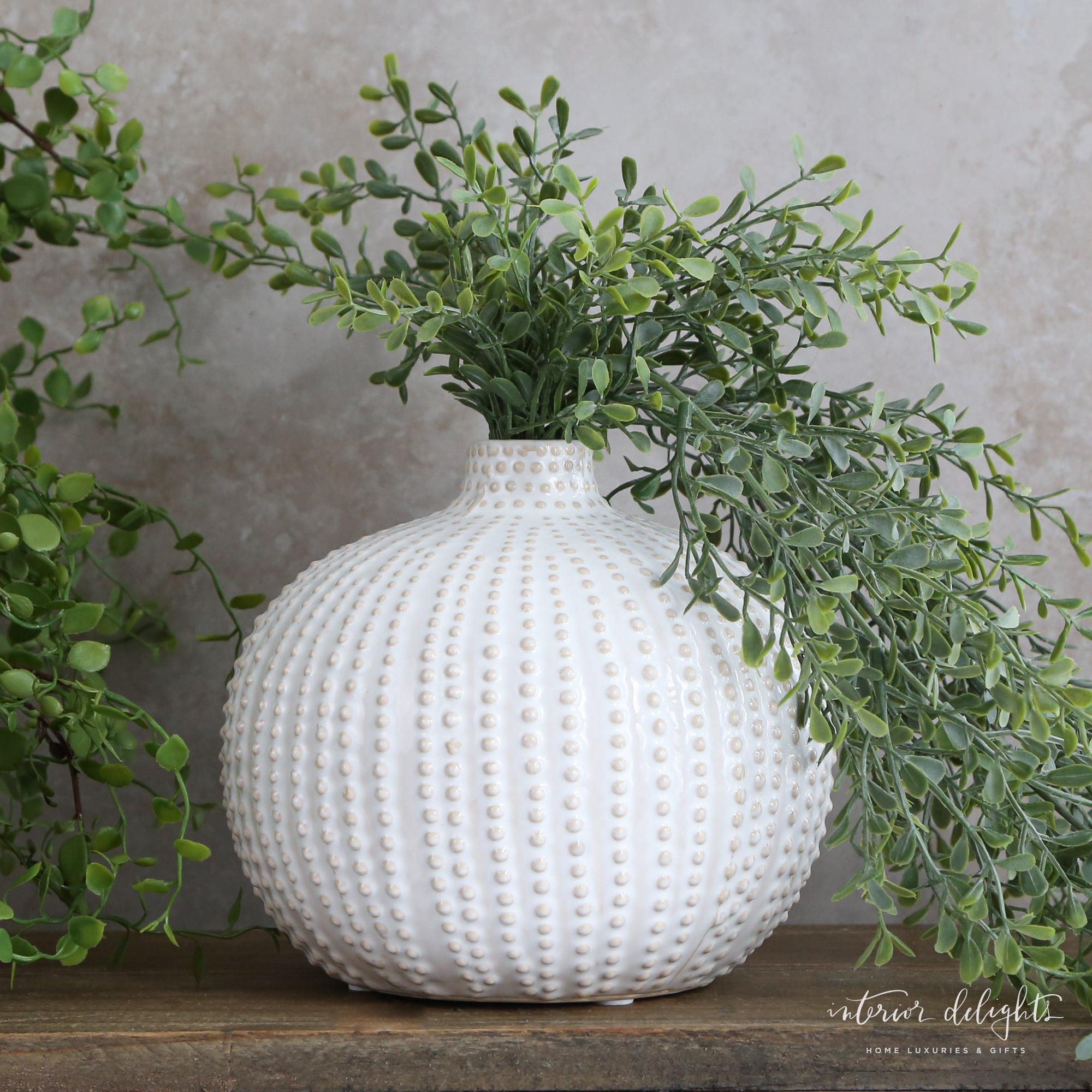 6" Sand Dot Round Vase showcasing its unique dotted vertical design and organic shape, perfect for adding a touch of charm to any decor.