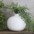 6" Sand Dot Round Vase showcasing its unique dotted vertical design and organic shape, perfect for adding a touch of charm to any decor.