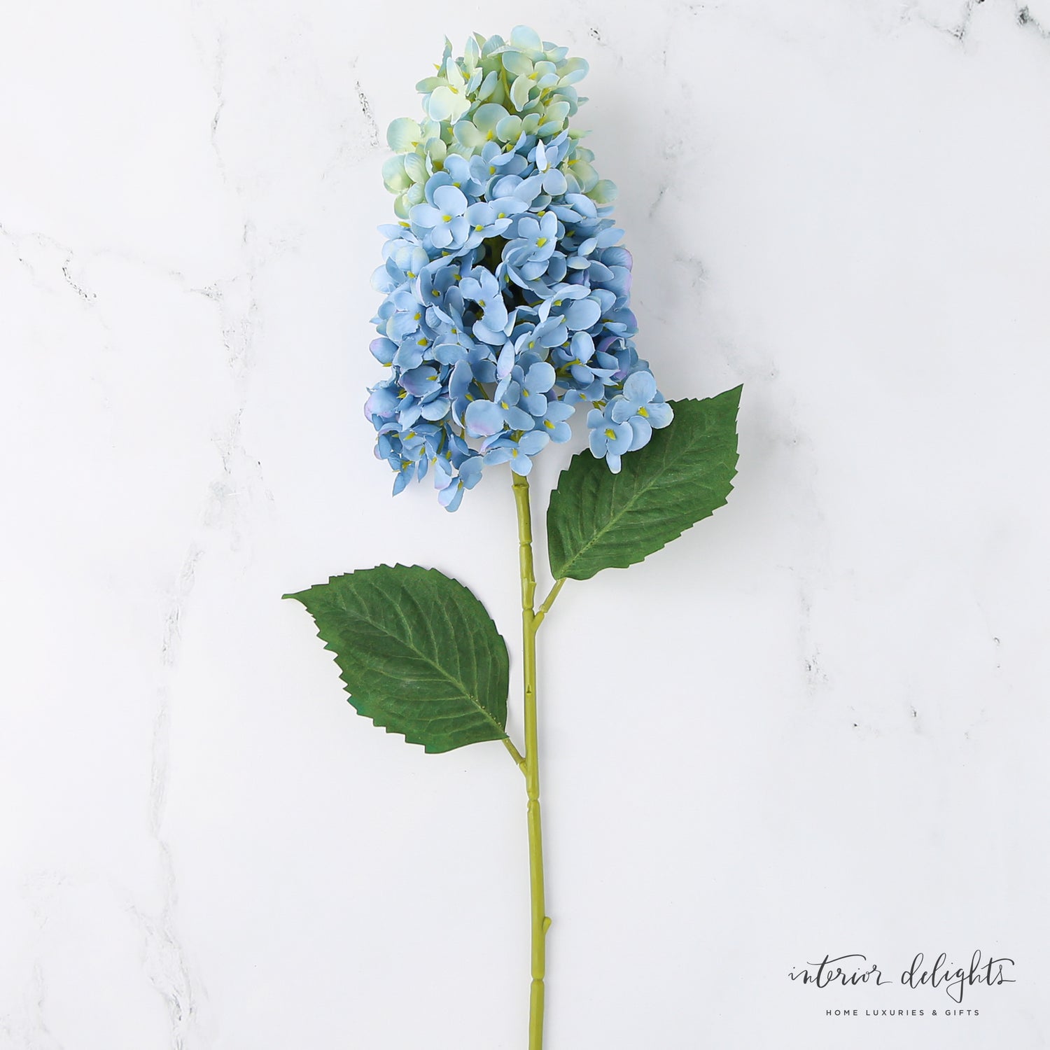 Summit Hydrangea Stem in blue color adding a touch of softness to any vase display.