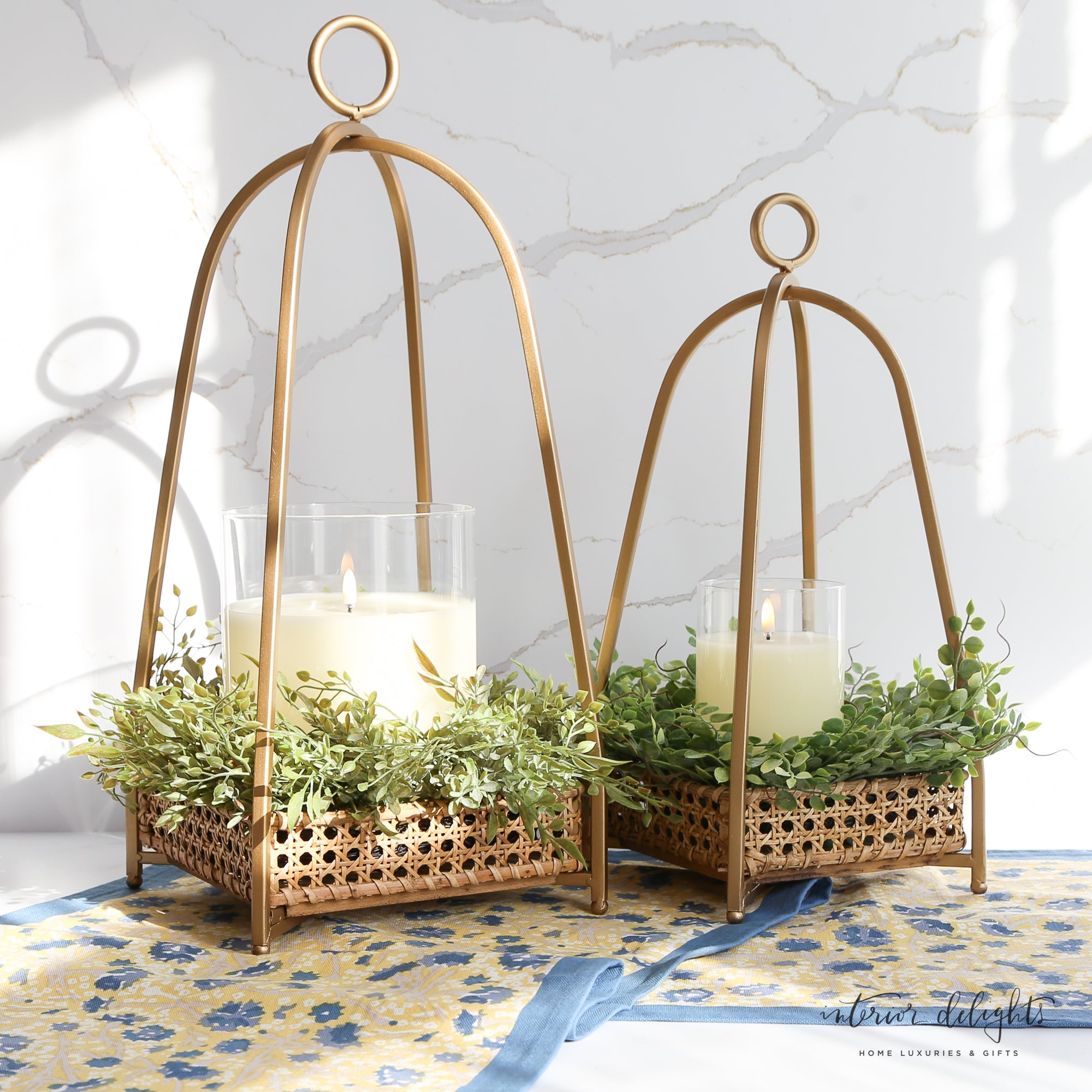 Stylish Cane Tray Lanterns in gold metal, perfect for adding sophistication to your decor.