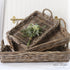 Nesting Willow Trays - Set of 3 displayed elegantly on a rustic wooden table, showcasing their natural charm and versatility.