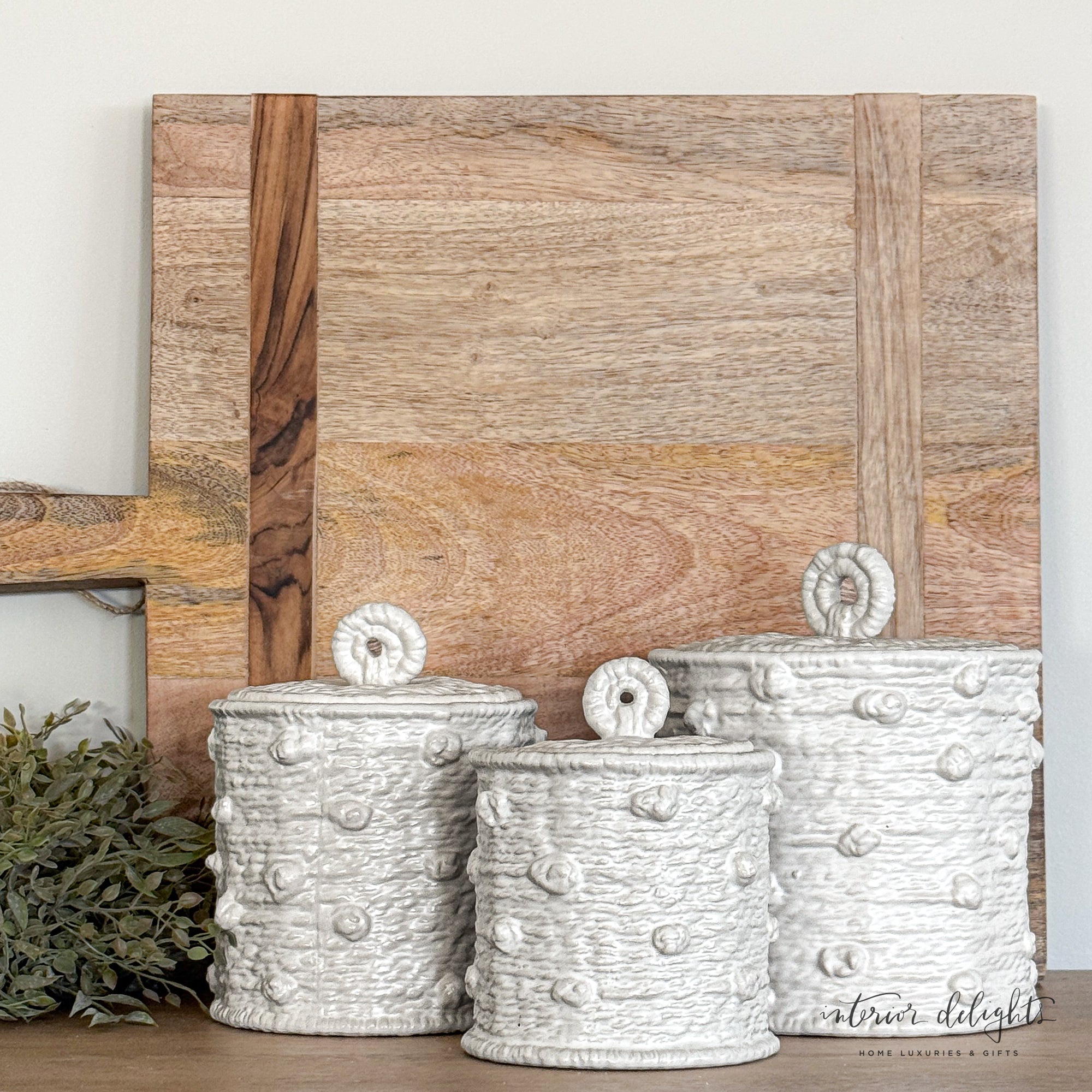 Close-up of the Knotted Canister Set showing the timeless woven knot pattern and artistic texture.