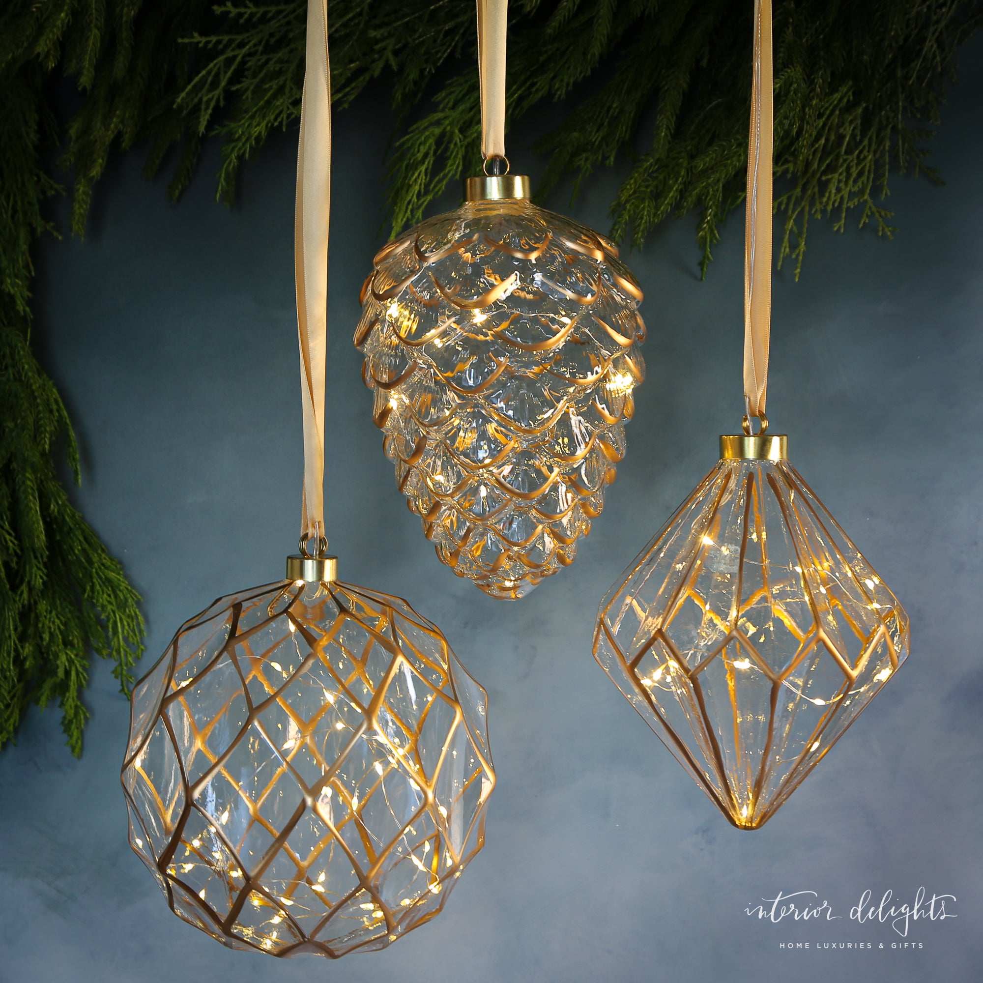 Etched Glass LED Individual Ornaments - Round shape with warm glowing lights for holiday decor.