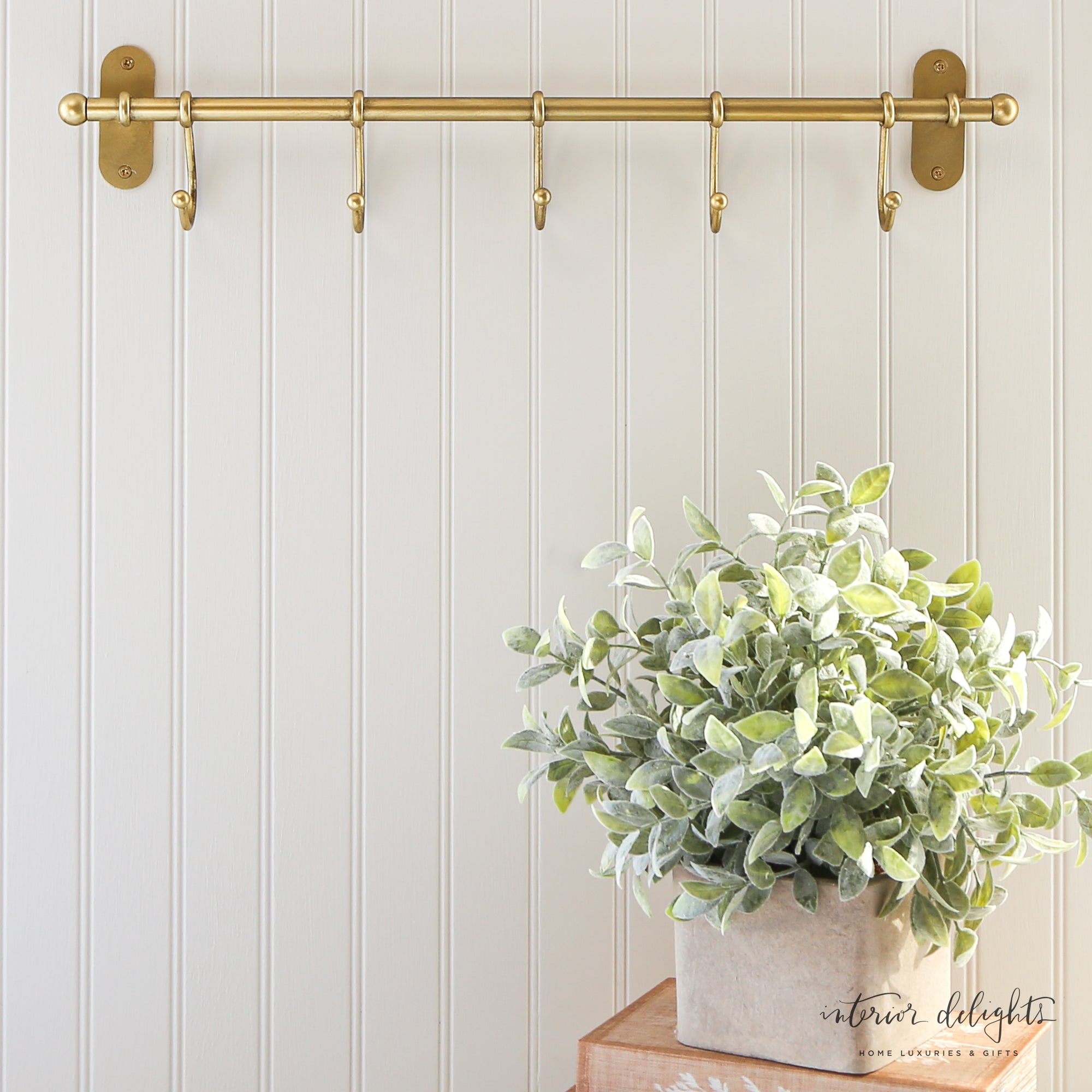 Close-up of Antiqued Metal Wall Hooks displaying vintage-inspired elegance, ideal for organizing coats and hats.