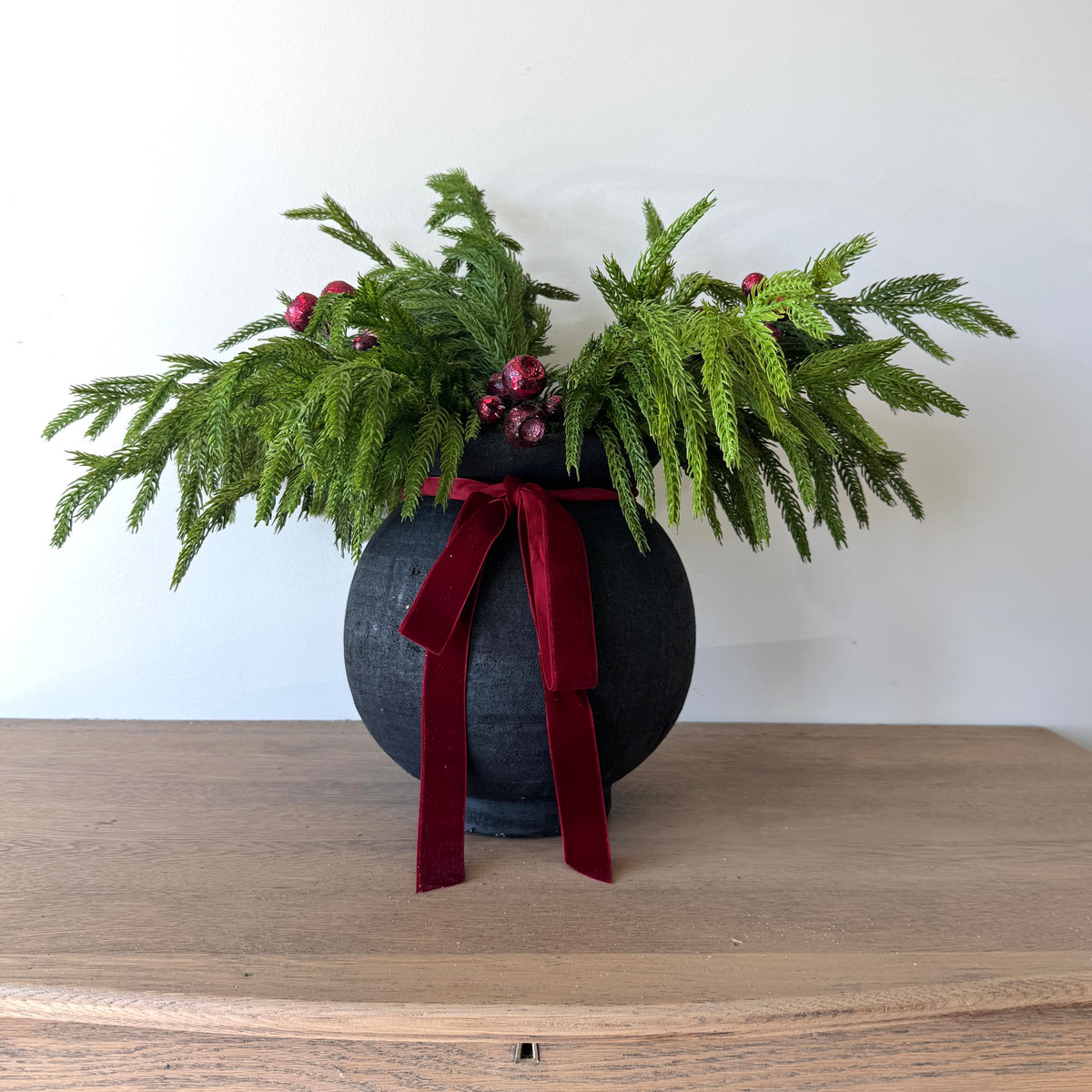 Black Paul Vase and Norfolk Pine Arrangement