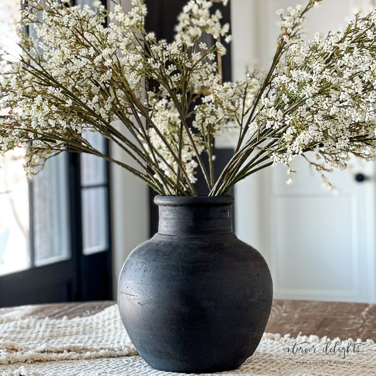 13.5 in Black Terracotta Vase showcasing seasonal florals for a bold statement in any room.