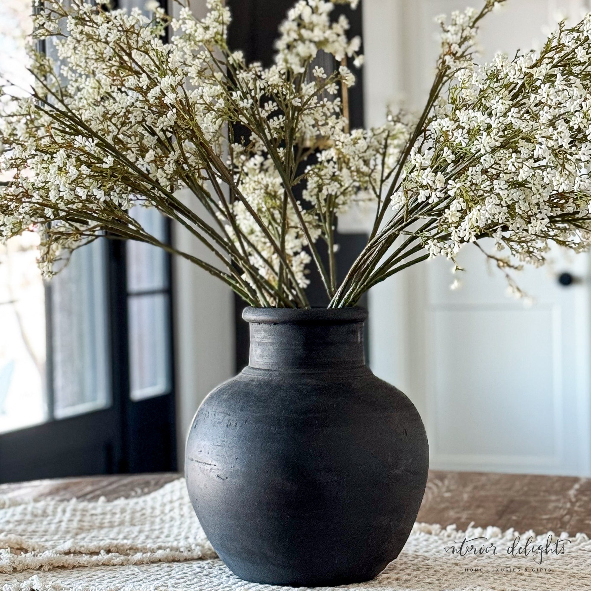 13.5 in Black Terracotta Vase showcasing seasonal florals for a bold statement in any room.