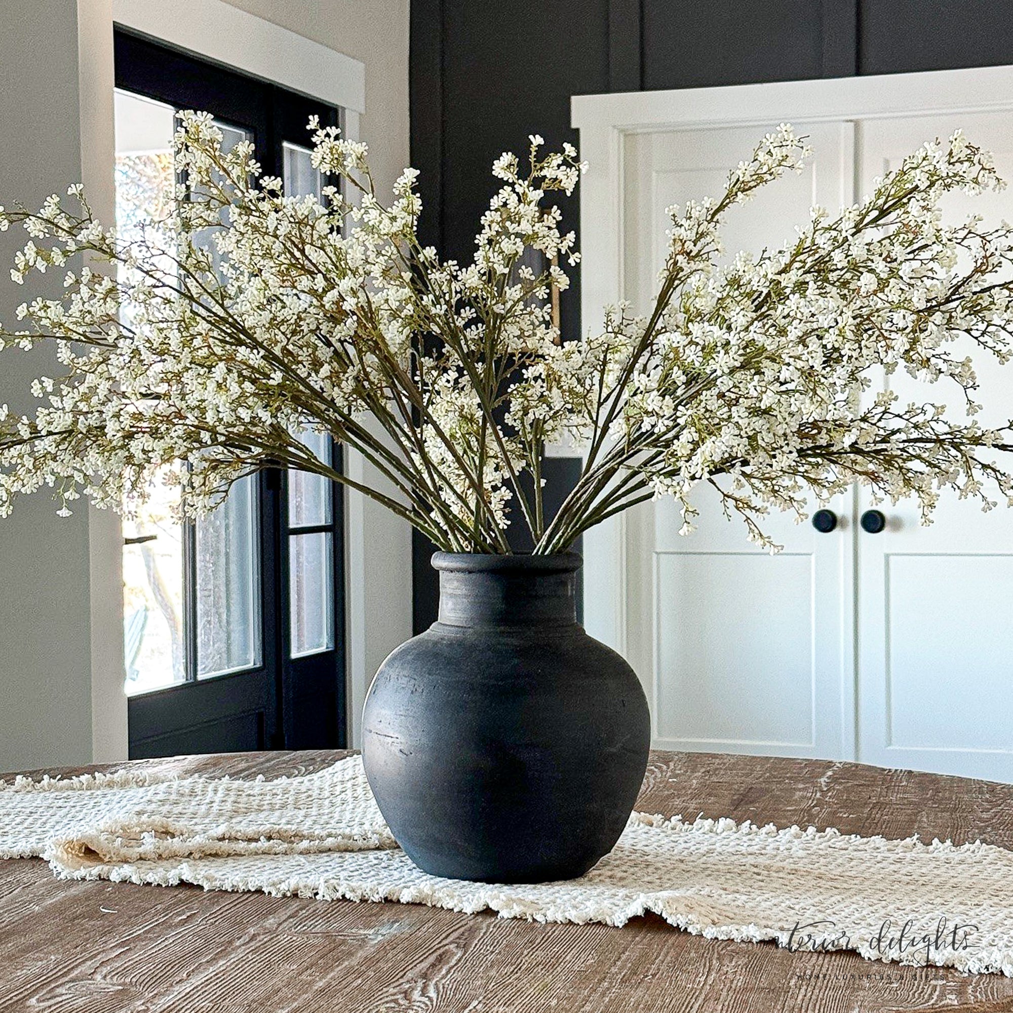 Elegant 13.5 in Black Terracotta Vase with a narrow opening, perfect for tall floral arrangements.